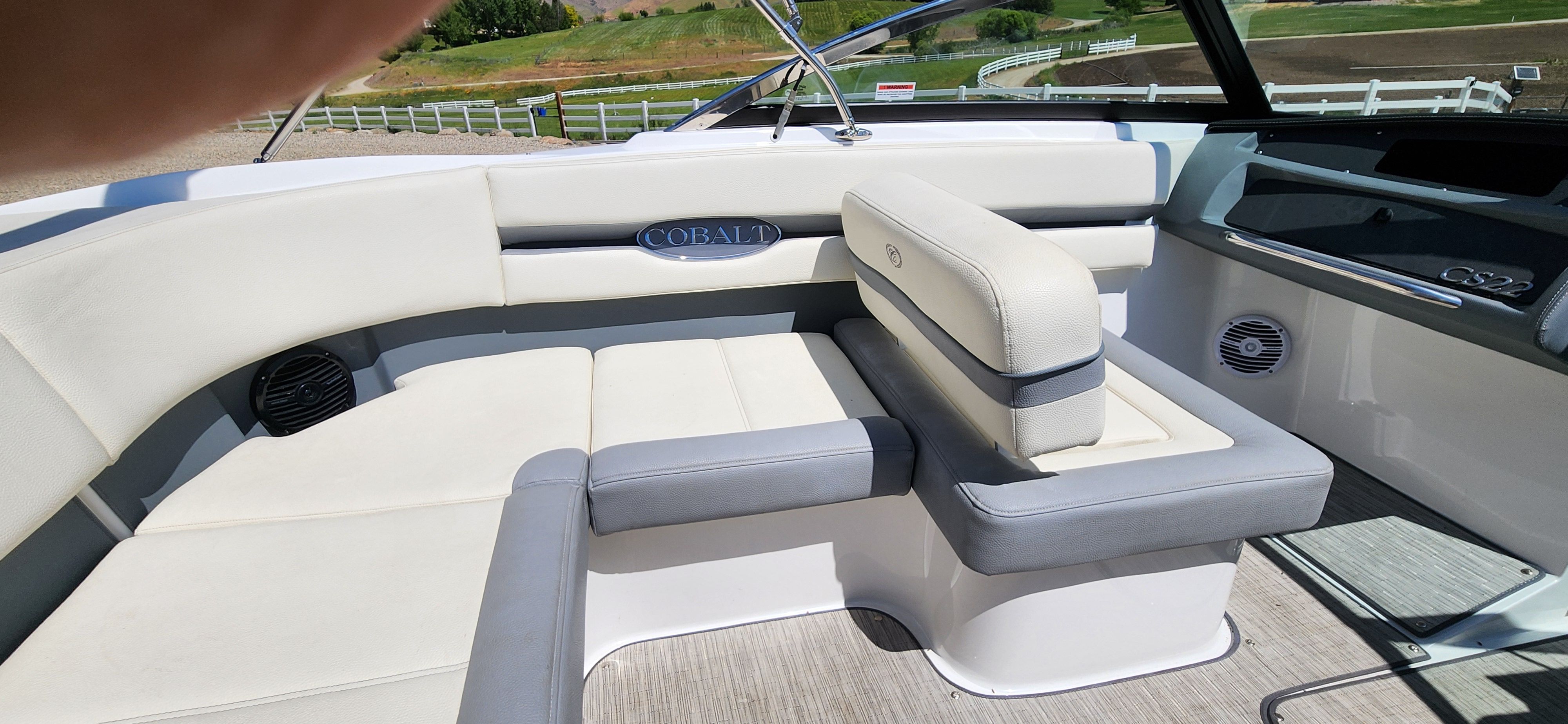 Interior of a Cobalt CS22 boat with white and gray seating.