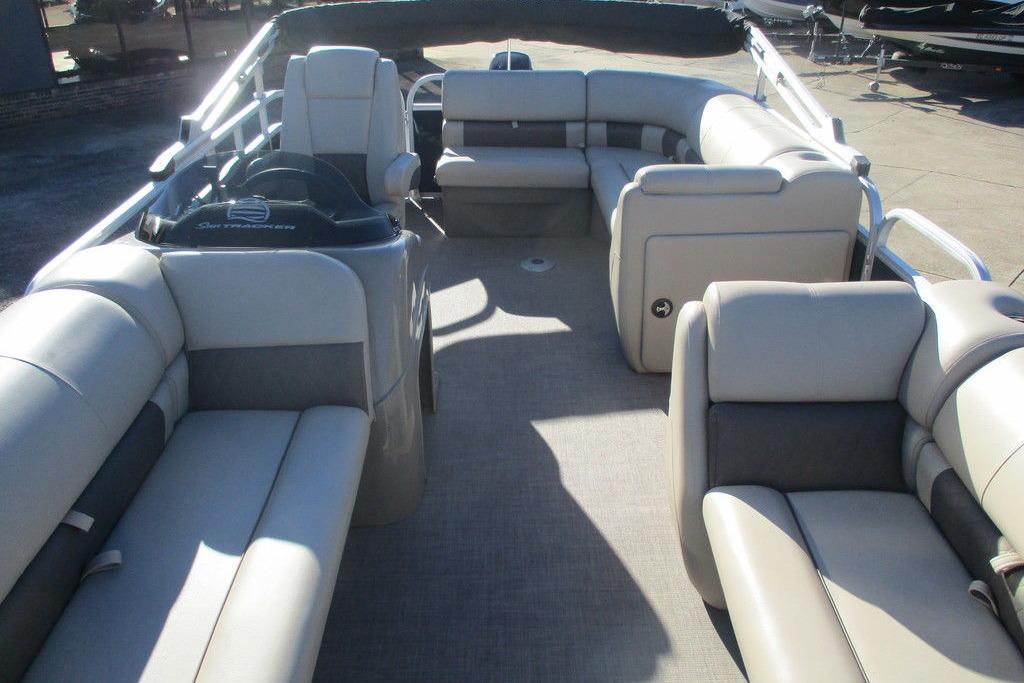 2022 Sun Tracker Party Barge 20 DLX interior with spacious seating and helm.