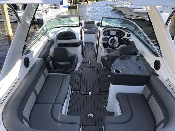 2020 Rinker 29QX BR boat interior with luxurious seating and modern dashboard.