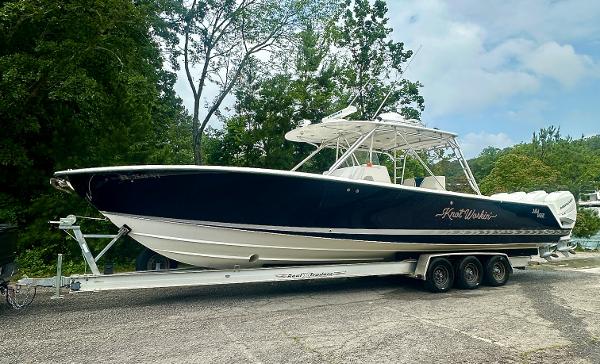 2008 SeaVee 390B boat on trailer, parked outdoors with trees in the background.