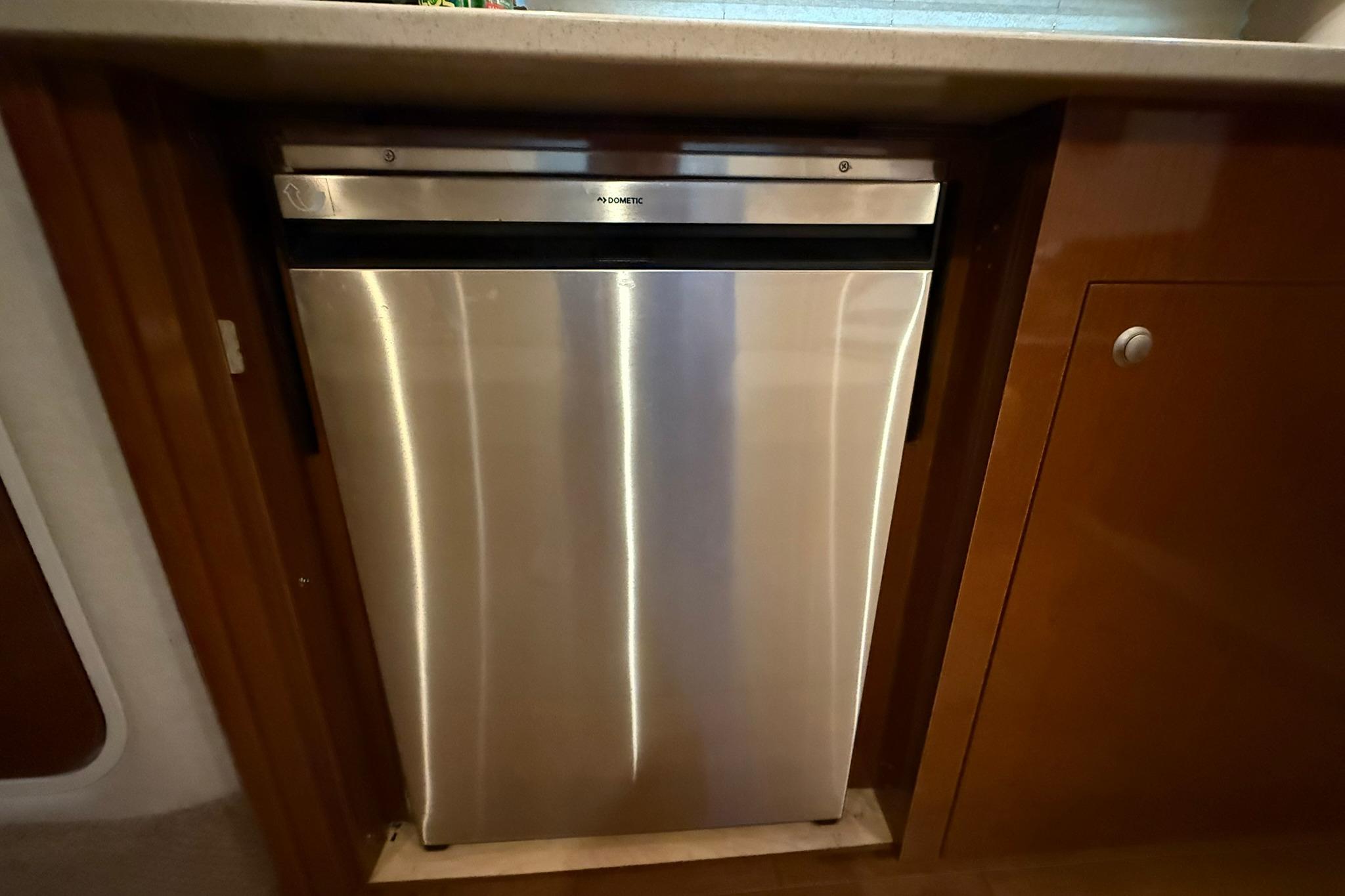 Stainless steel refrigerator in 2009 Sea Ray 350 Sundancer yacht kitchen.