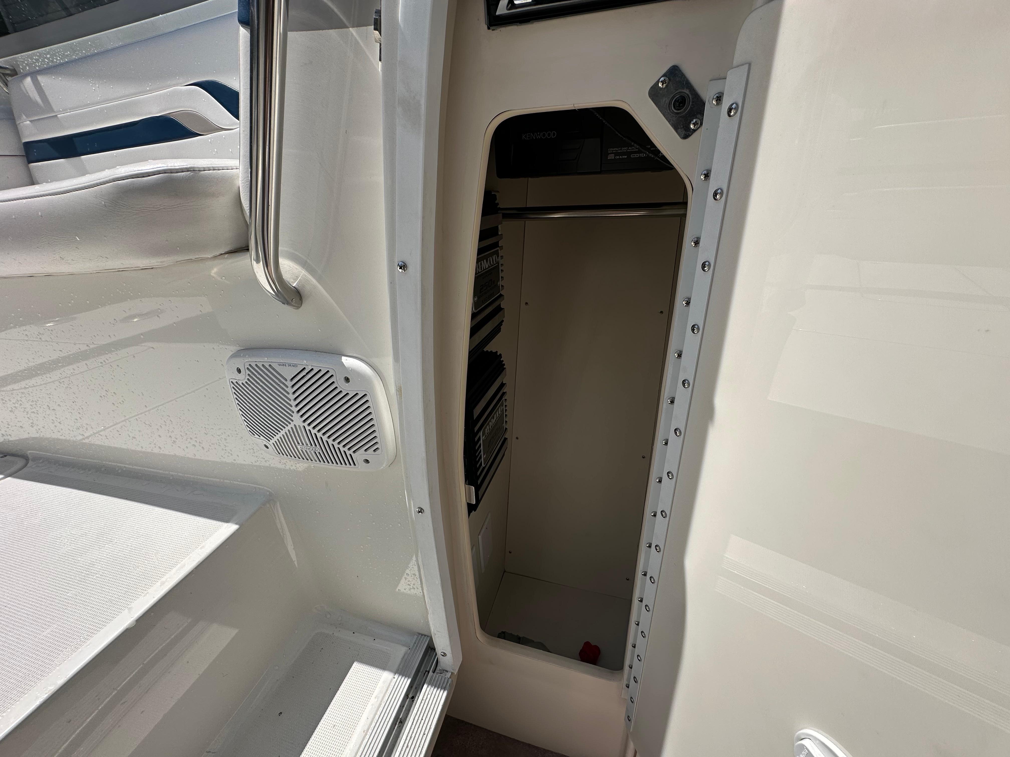 2000 Formula 330 SS boat interior with open storage compartment and speaker.