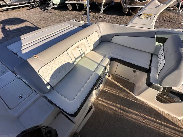 2016 Sea Ray 240 Sundeck interior seating with beige upholstery and modern design.