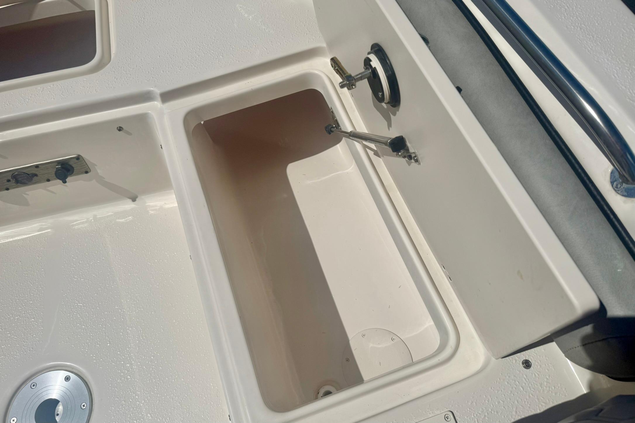 2026 Carolina Skiff 21 Ultra Elite boat storage compartment detail.