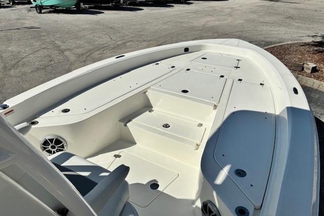 2026 Mako 24 APEX boat deck with seating and storage compartments.