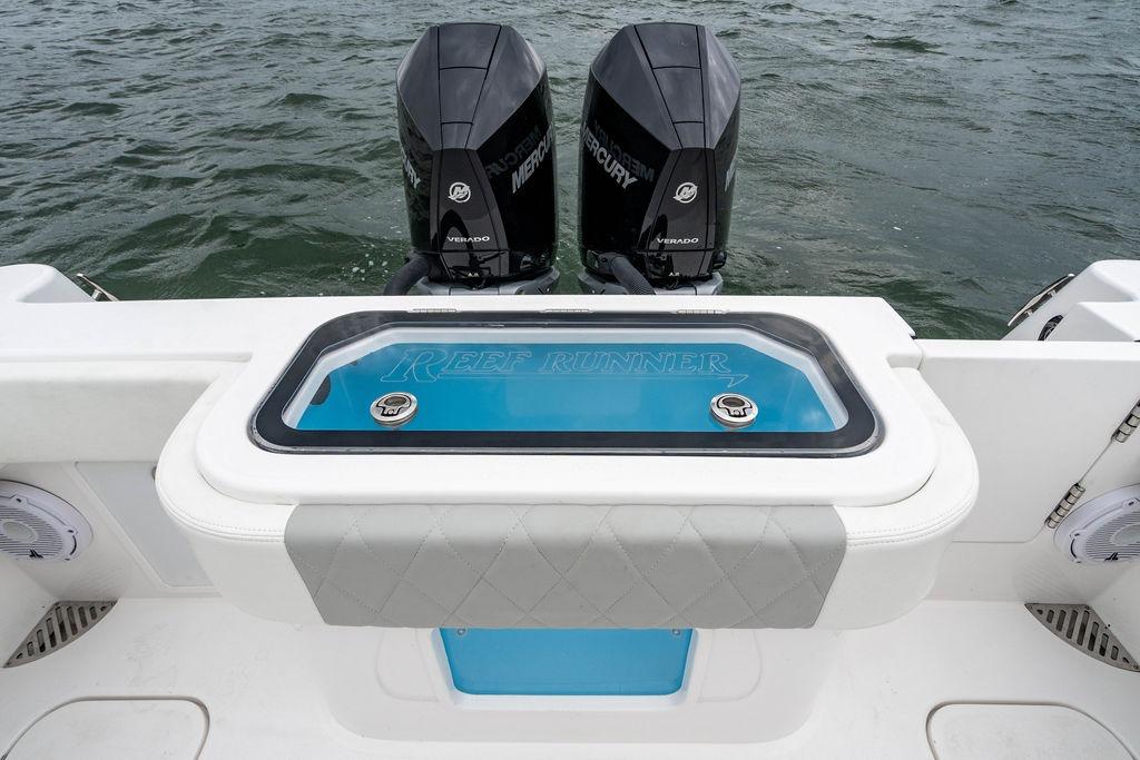 2027 Reef Runner 280 boat with dual Mercury engines on water.
