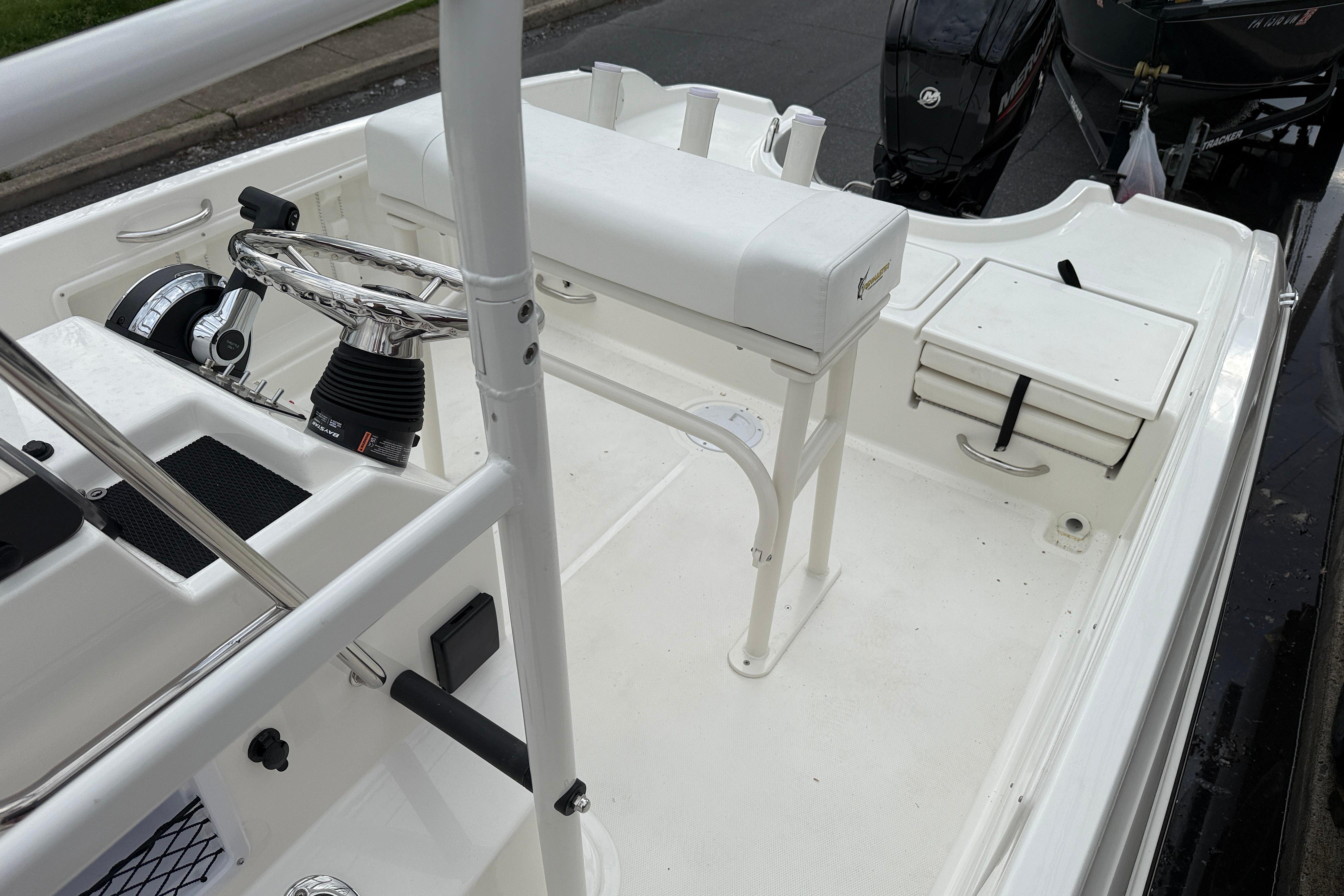 2026 Bayliner Trophy T18 boat interior with steering wheel and seating area.