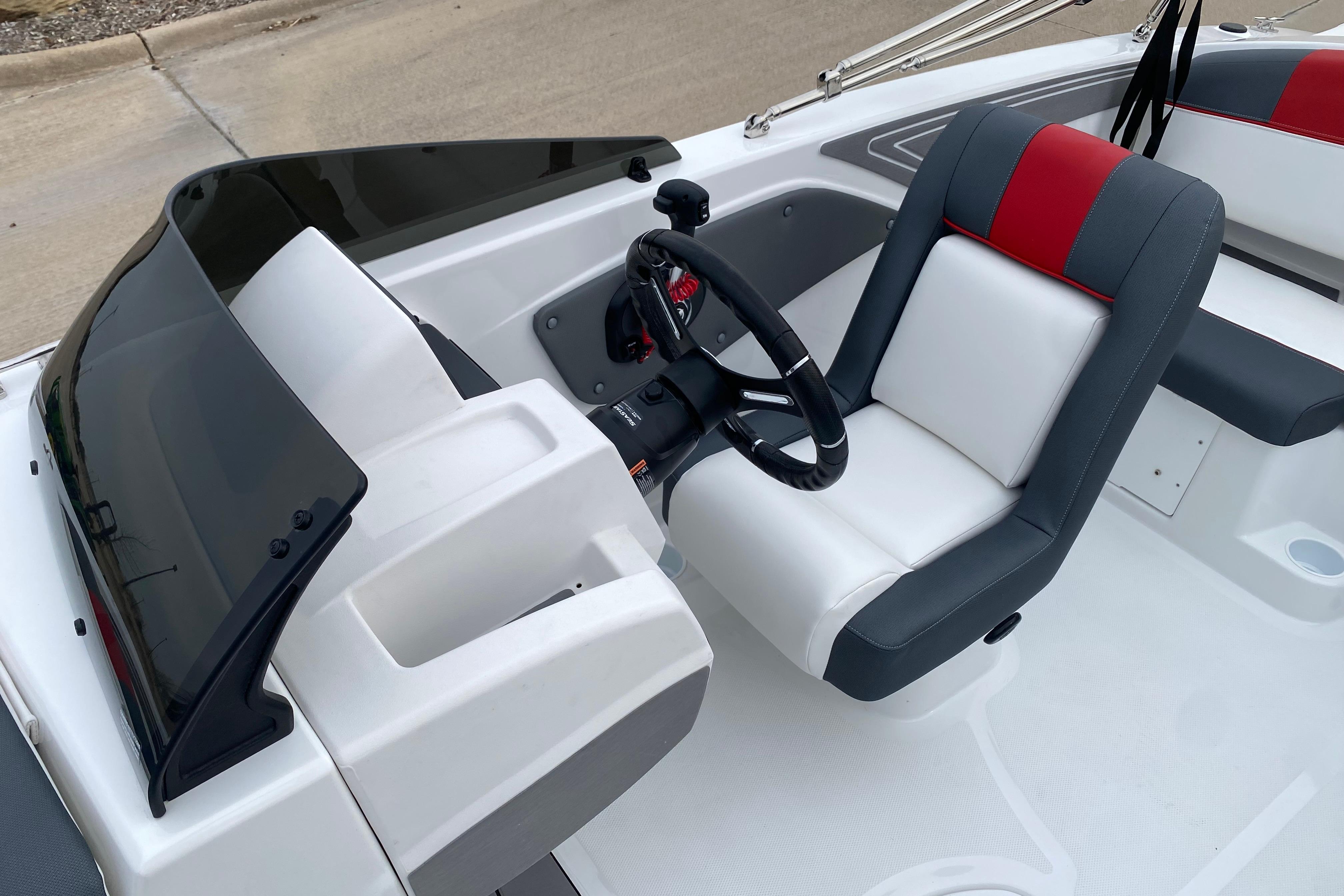 2026 Tahoe T21 boat interior with steering wheel and modern seating design.
