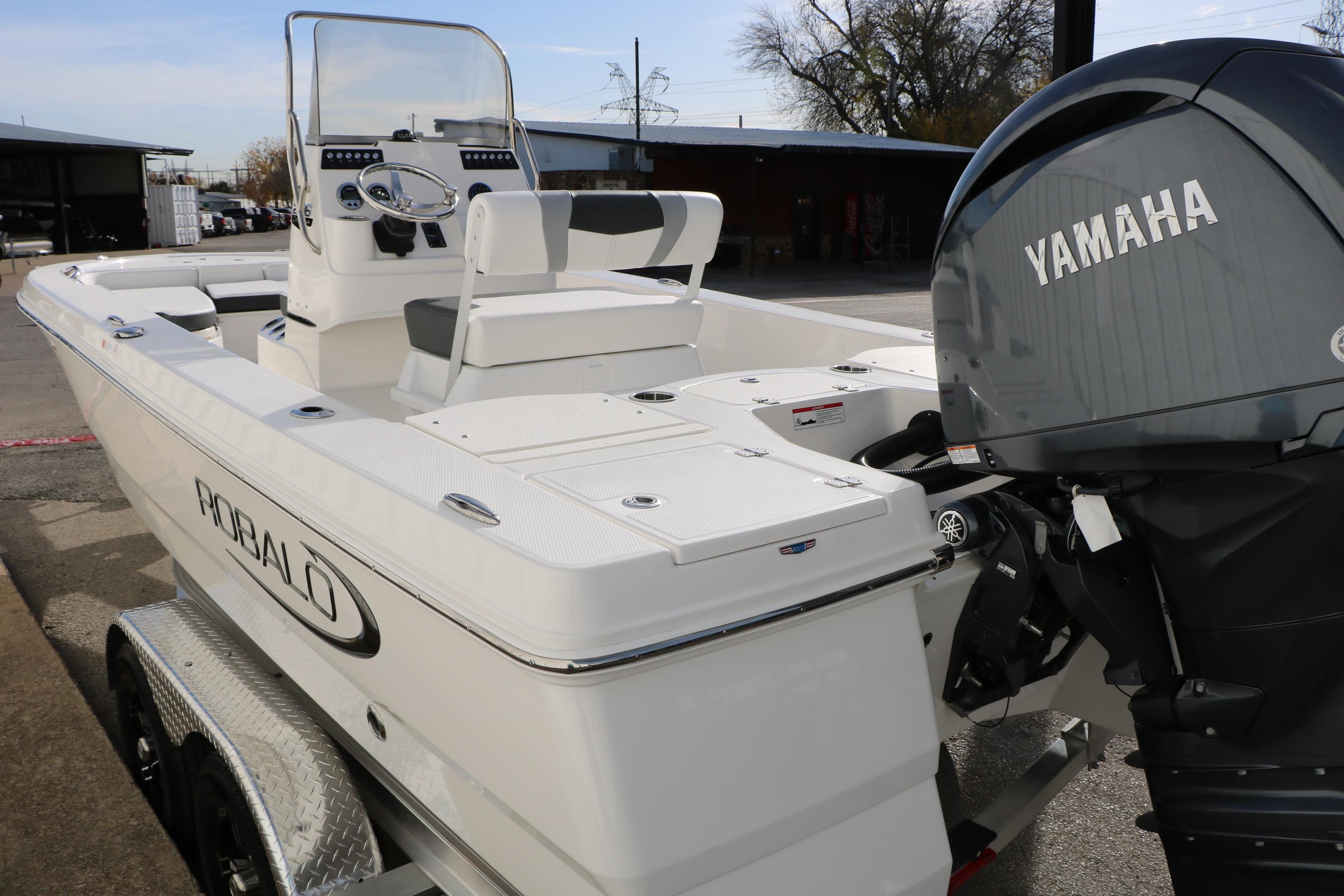 2026 Robalo 206 Cayman boat with Yamaha engine on trailer, outdoor setting.