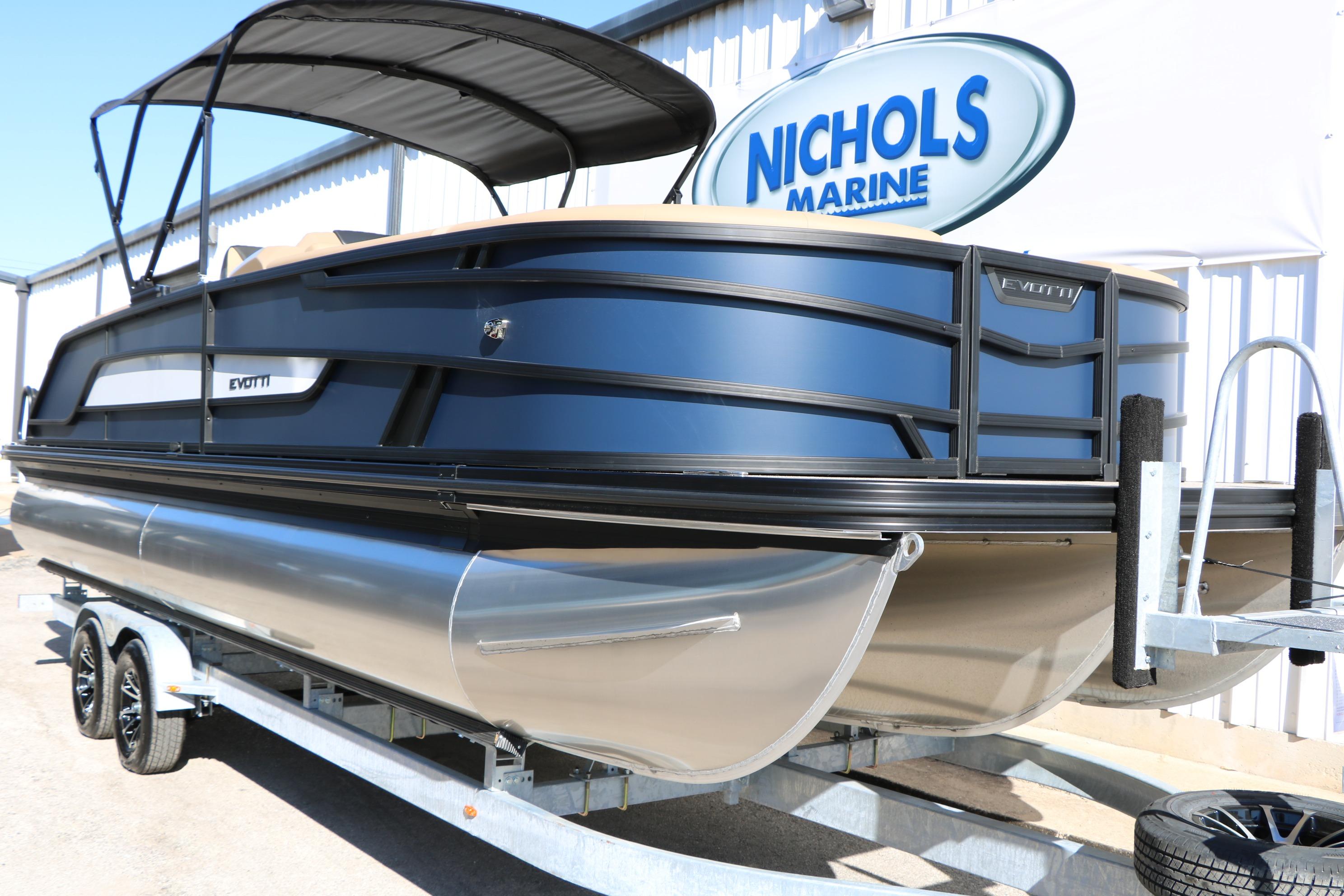 2026 Evotti 525 QL Tri-Toon boat on trailer at Nichols Marine dealership.