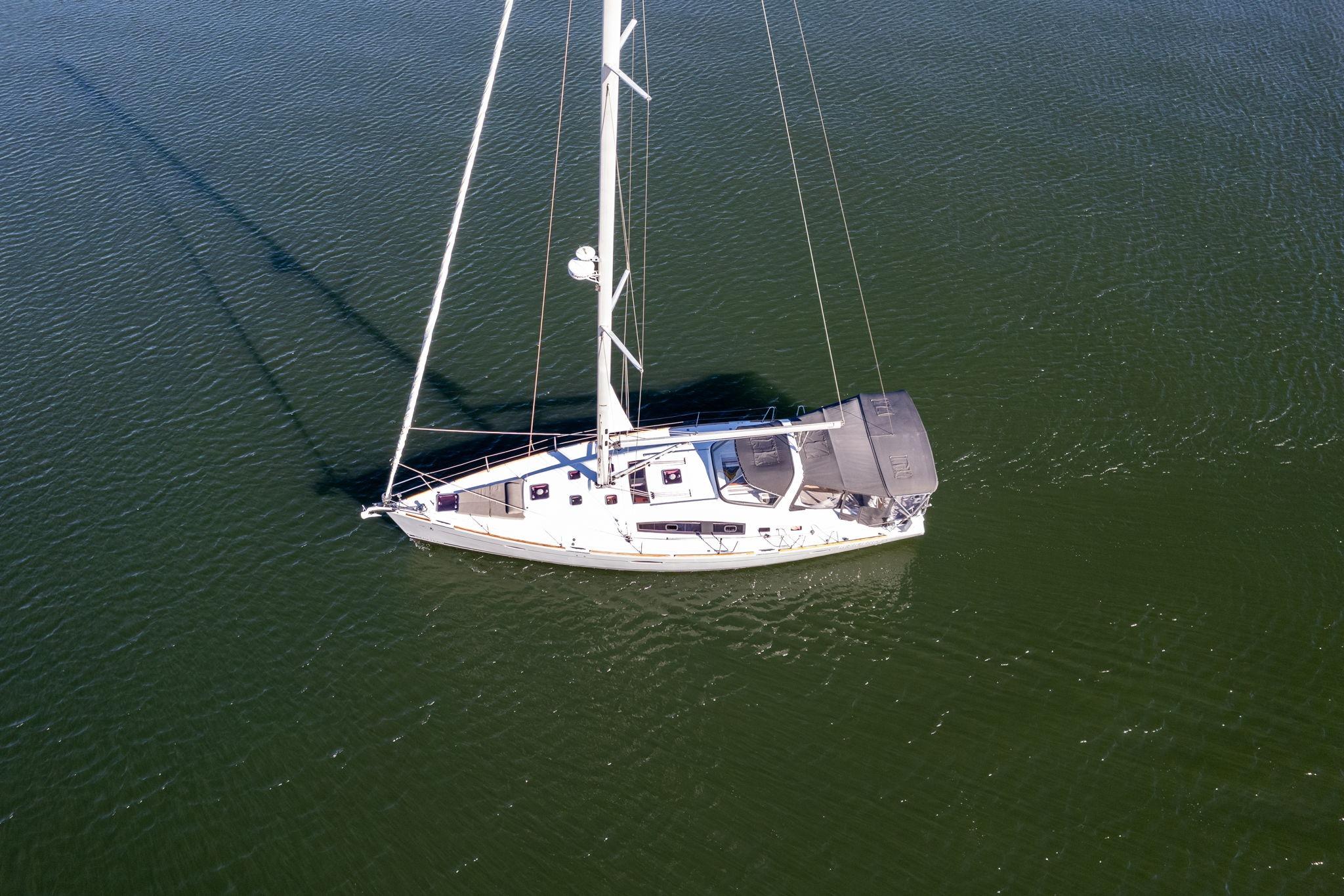 Aerial view of 2013 Beneteau Oceanis 50 sailboat on calm water.