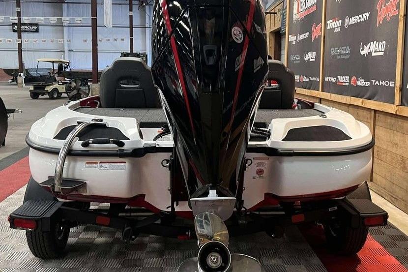2026 Nitro Z18 Pro boat with powerful outboard motor in showroom.