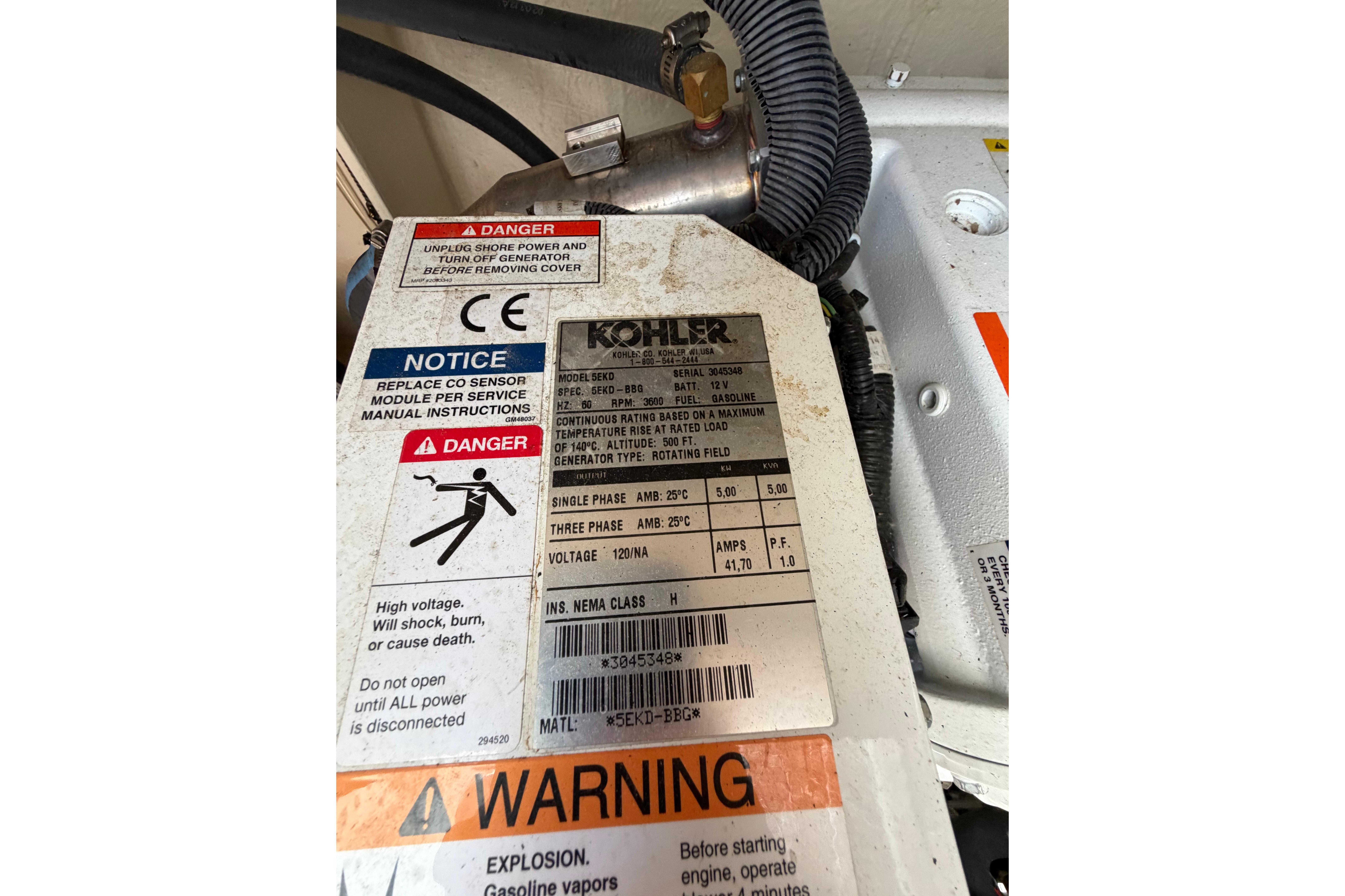 Kohler generator label with safety warnings on a 2012 Sea Ray Sundancer 370.