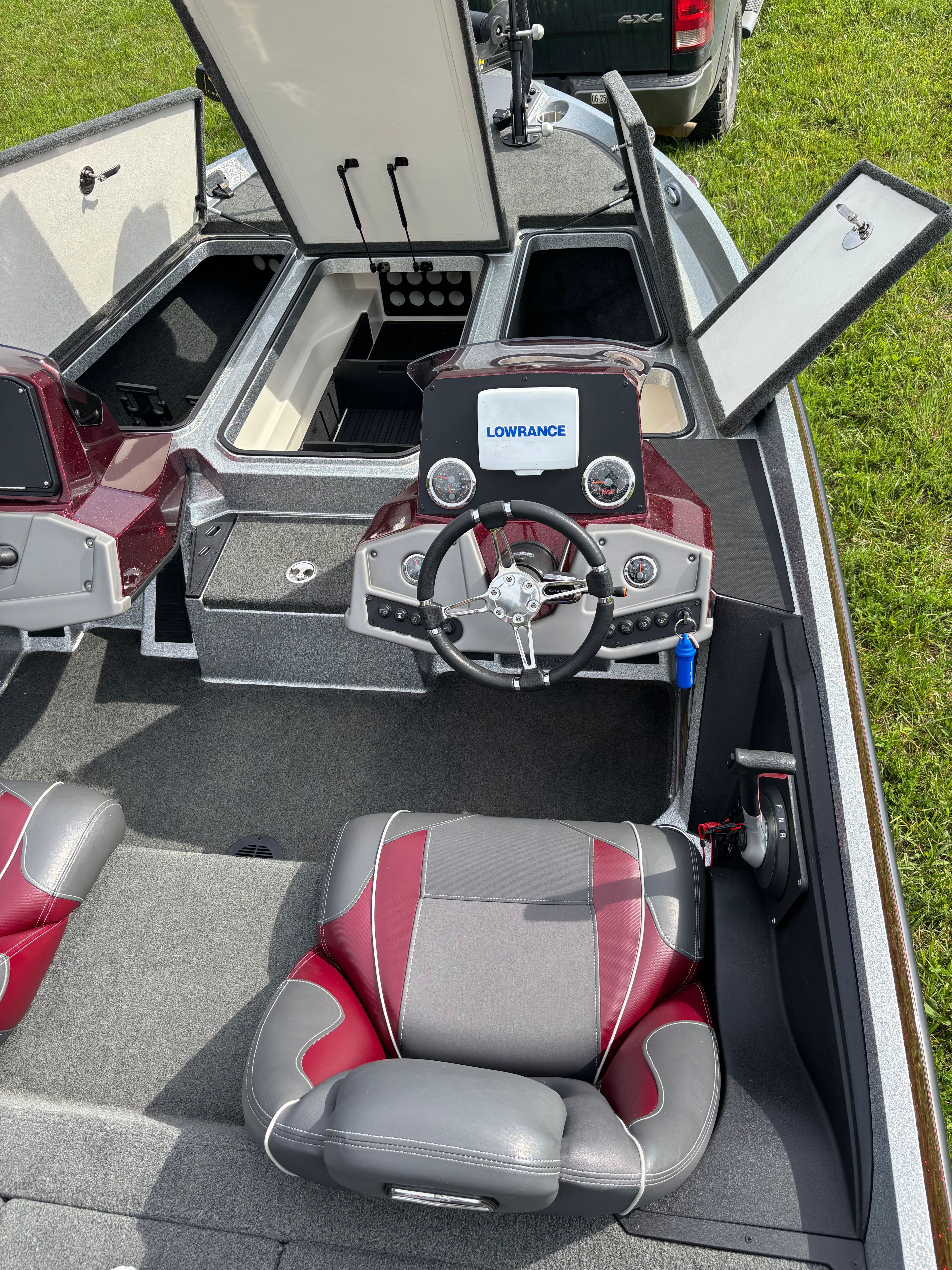 A 2016 Ranger Z 185 boat with gray and red seats and a modern helm station.