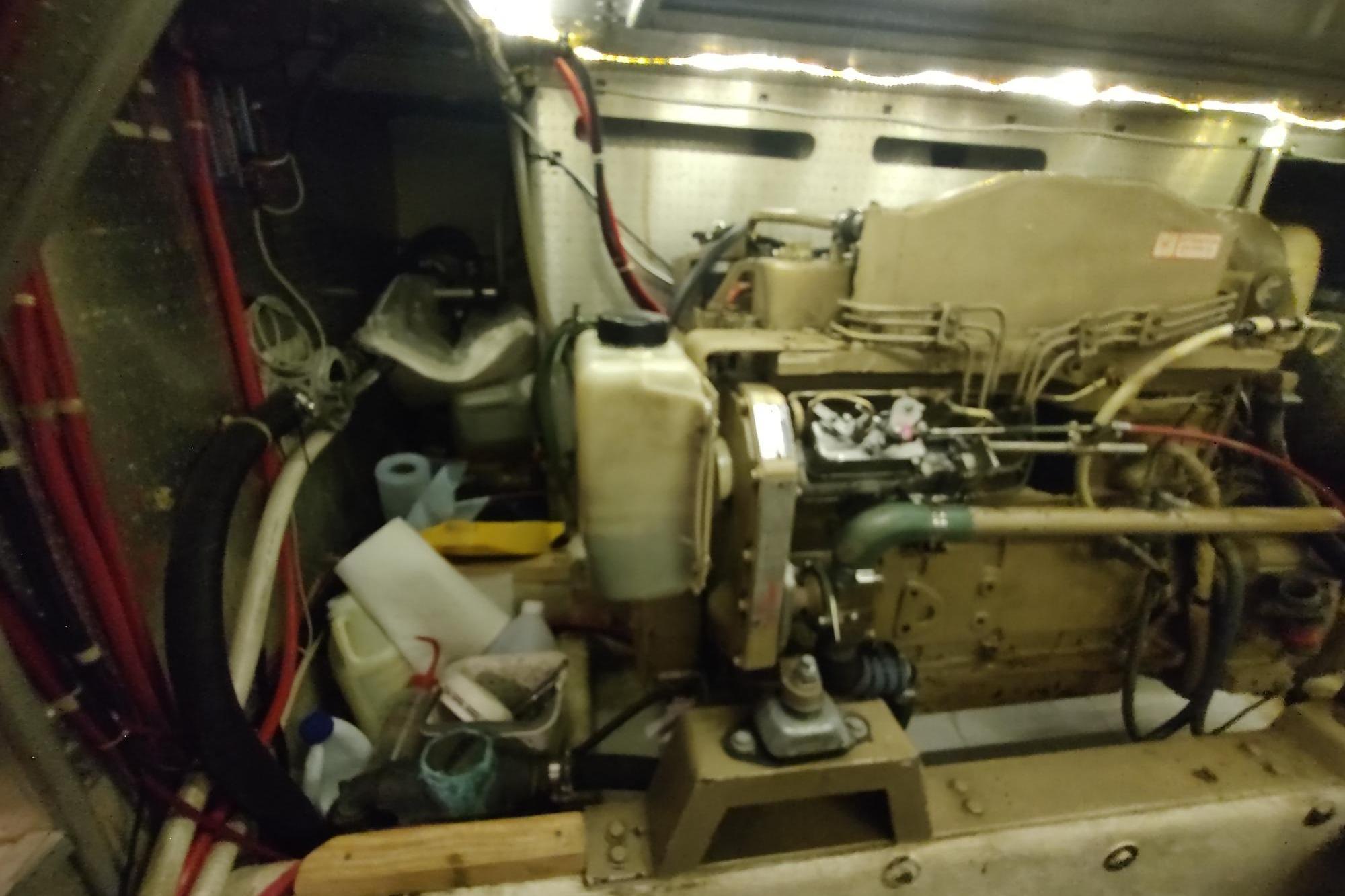 Engine room of a 1989 Hyatt Double Cabin Motoryacht with visible machinery and components.