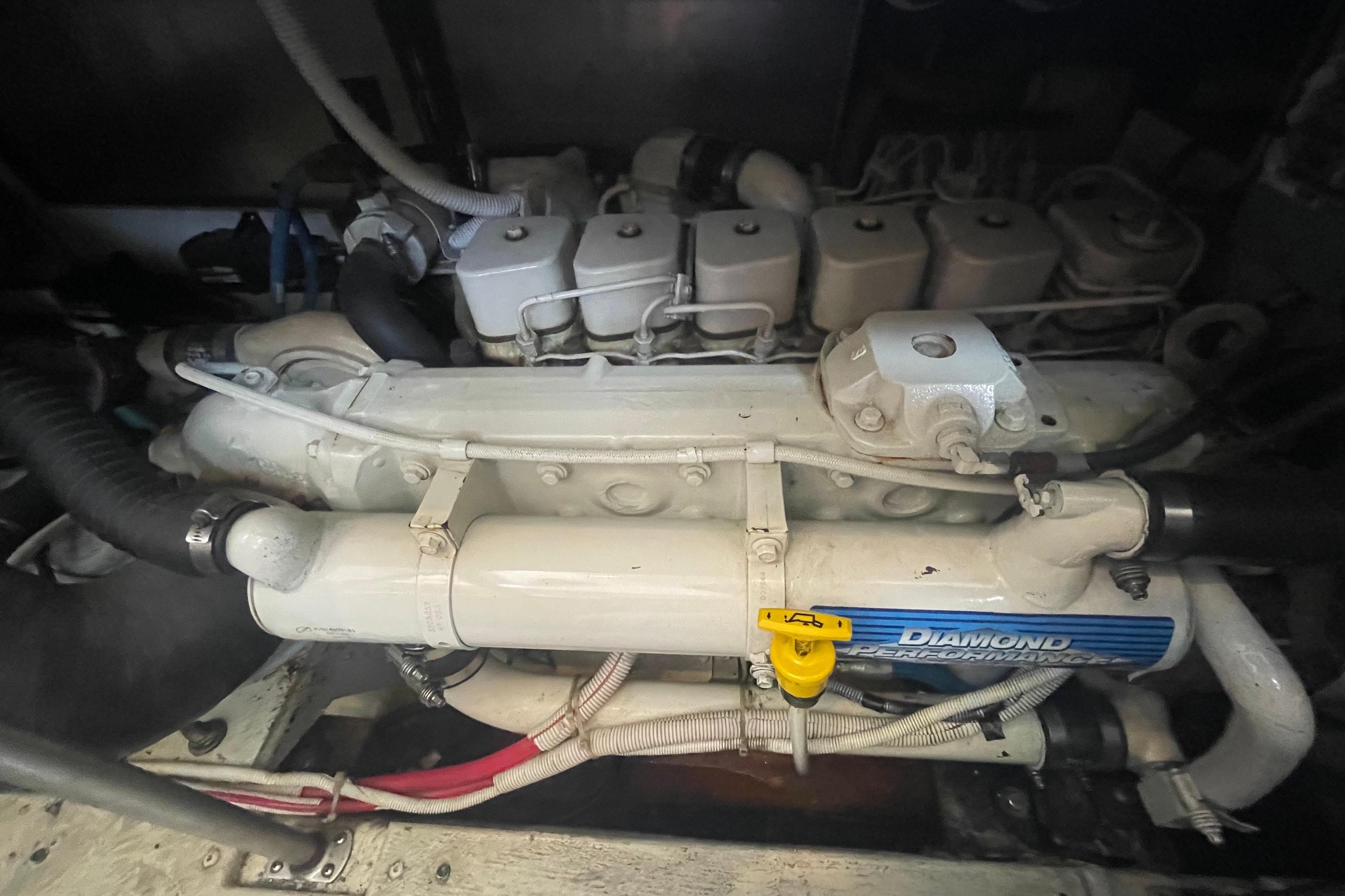 Engine of a 2002 Carver 410 Sport Sedan boat, showcasing Diamond Performance components.