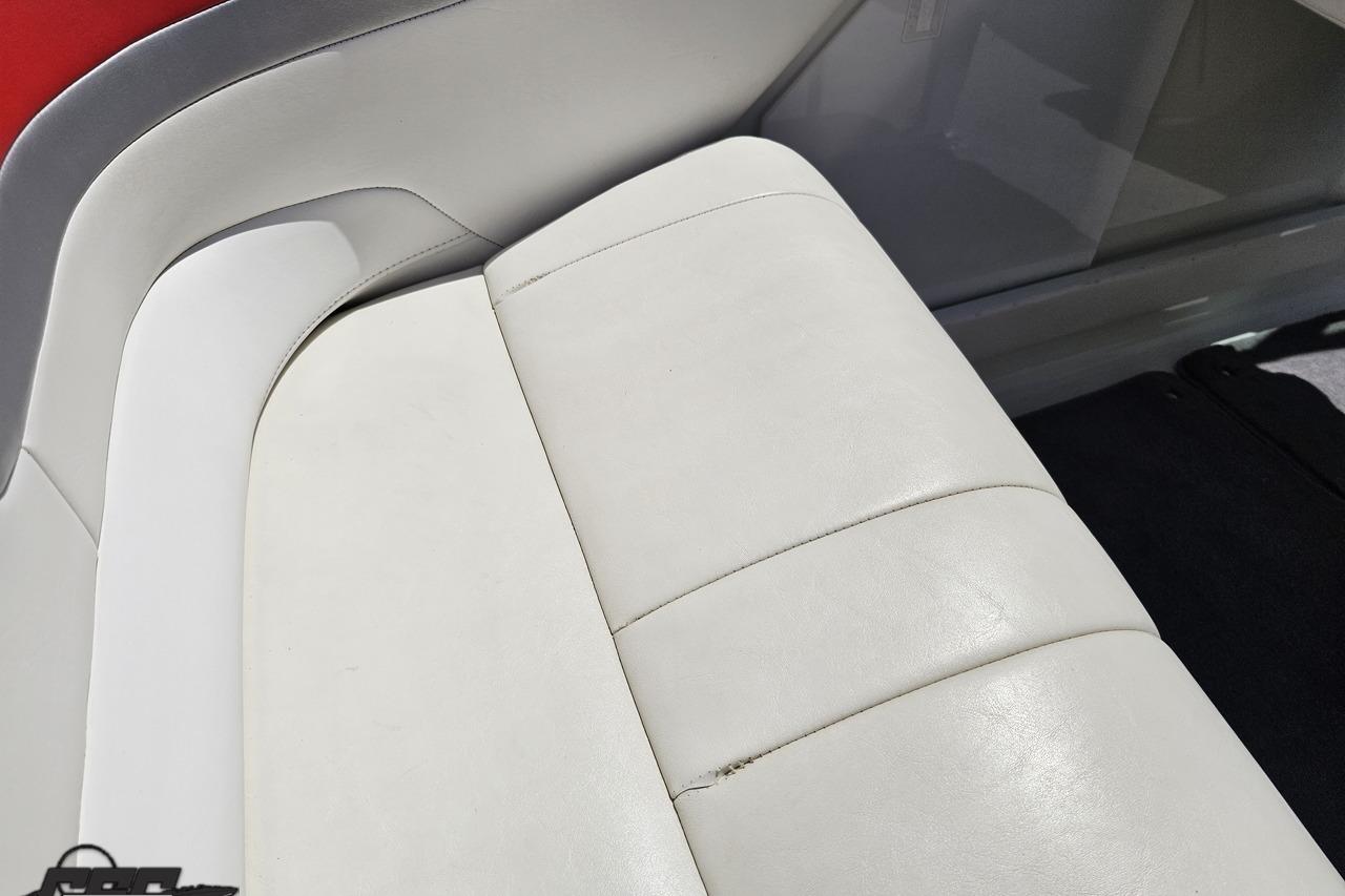 White leather seat in a 2005 Formula 271 FASTech boat interior.