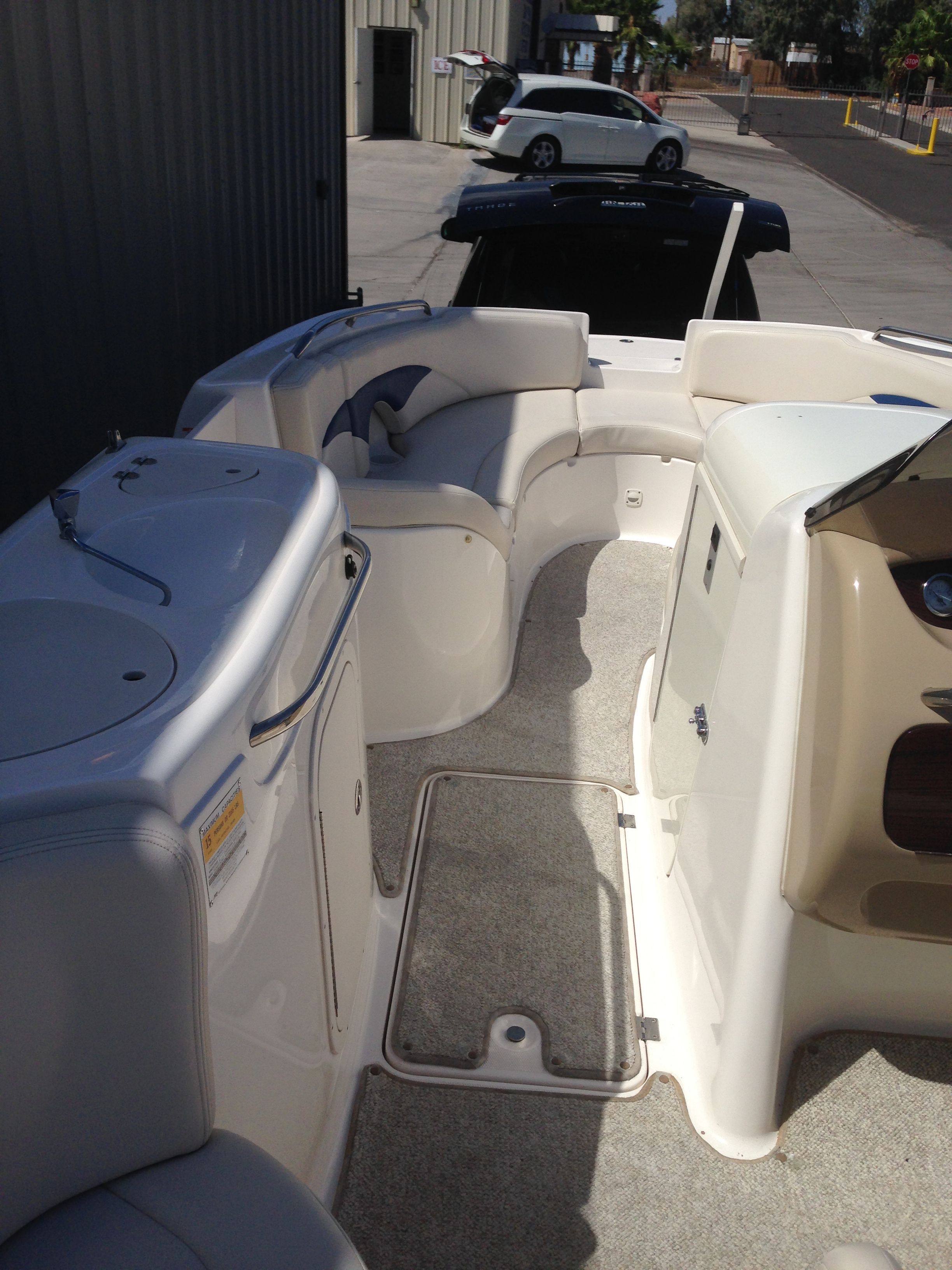 Interior of a 2003 Chaparral Sunesta 242 boat, featuring seating area.
