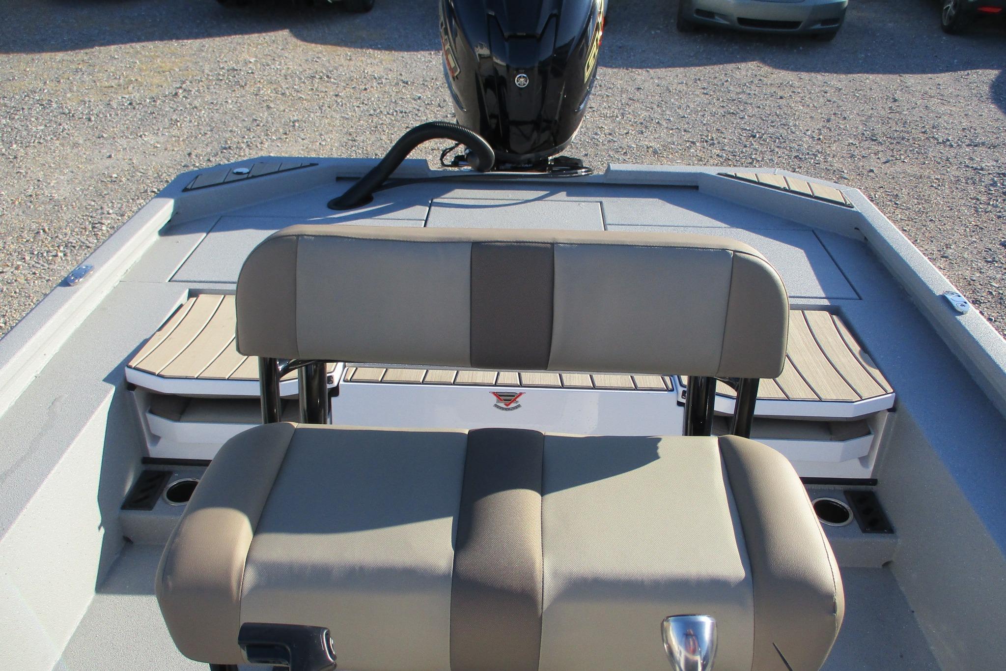2026 Vexus ACX2210 boat interior with beige seating and motor.