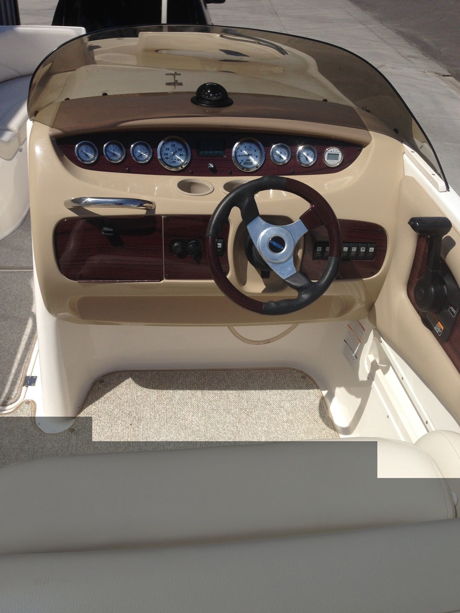 Cockpit of a 2003 Chaparral Sunesta 242 boat.