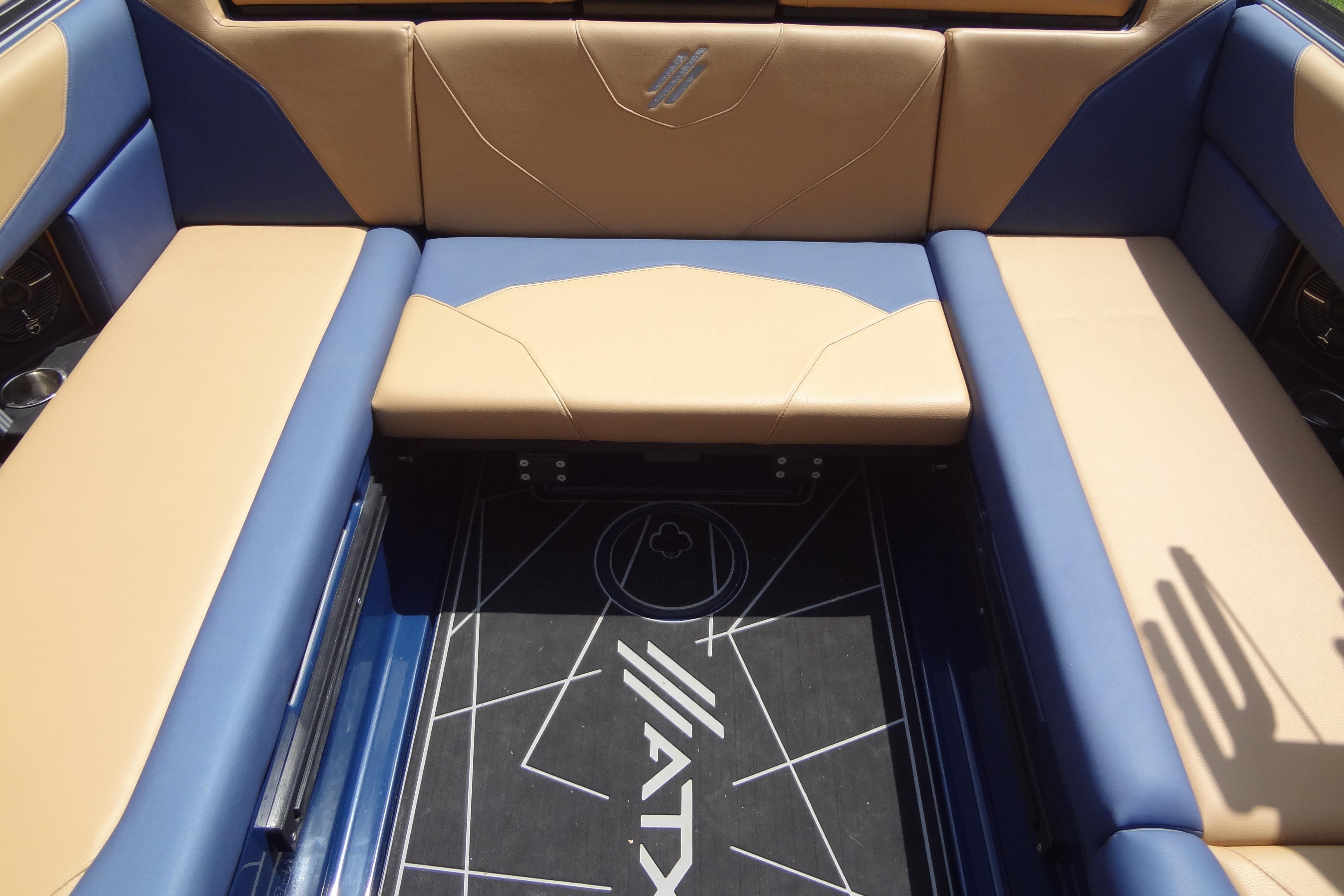 2022 ATX Surf Boats 24 Type-S interior with blue and tan seating.