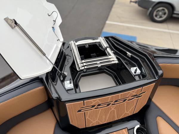 2025 Yamaha Boats 255XD, open storage compartment with ladder, sleek design, tan and black interior.