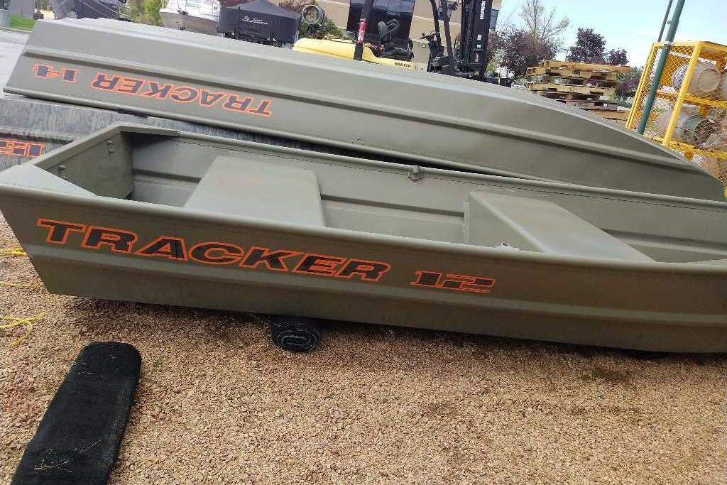 2026 Tracker Grizzly 12 Jon boat displayed outdoors on gravel.