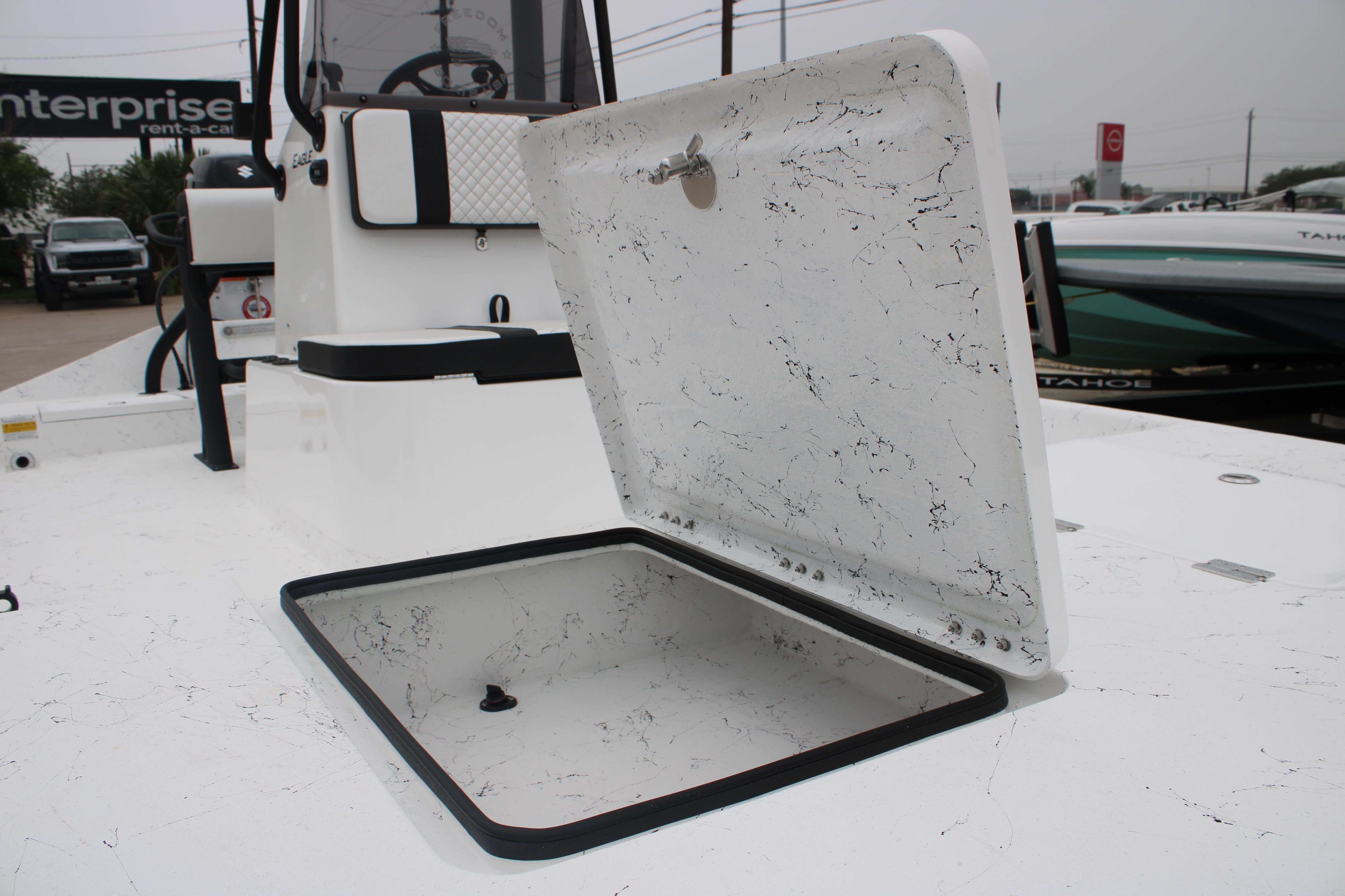 Open storage compartment on 2026 Freedom Boats 16' Eagle deck.