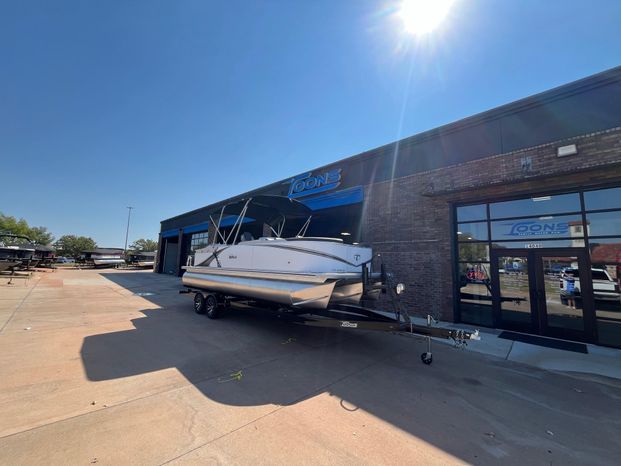 2025 Tahoe LTZ QL boat outside a store under sunny skies.