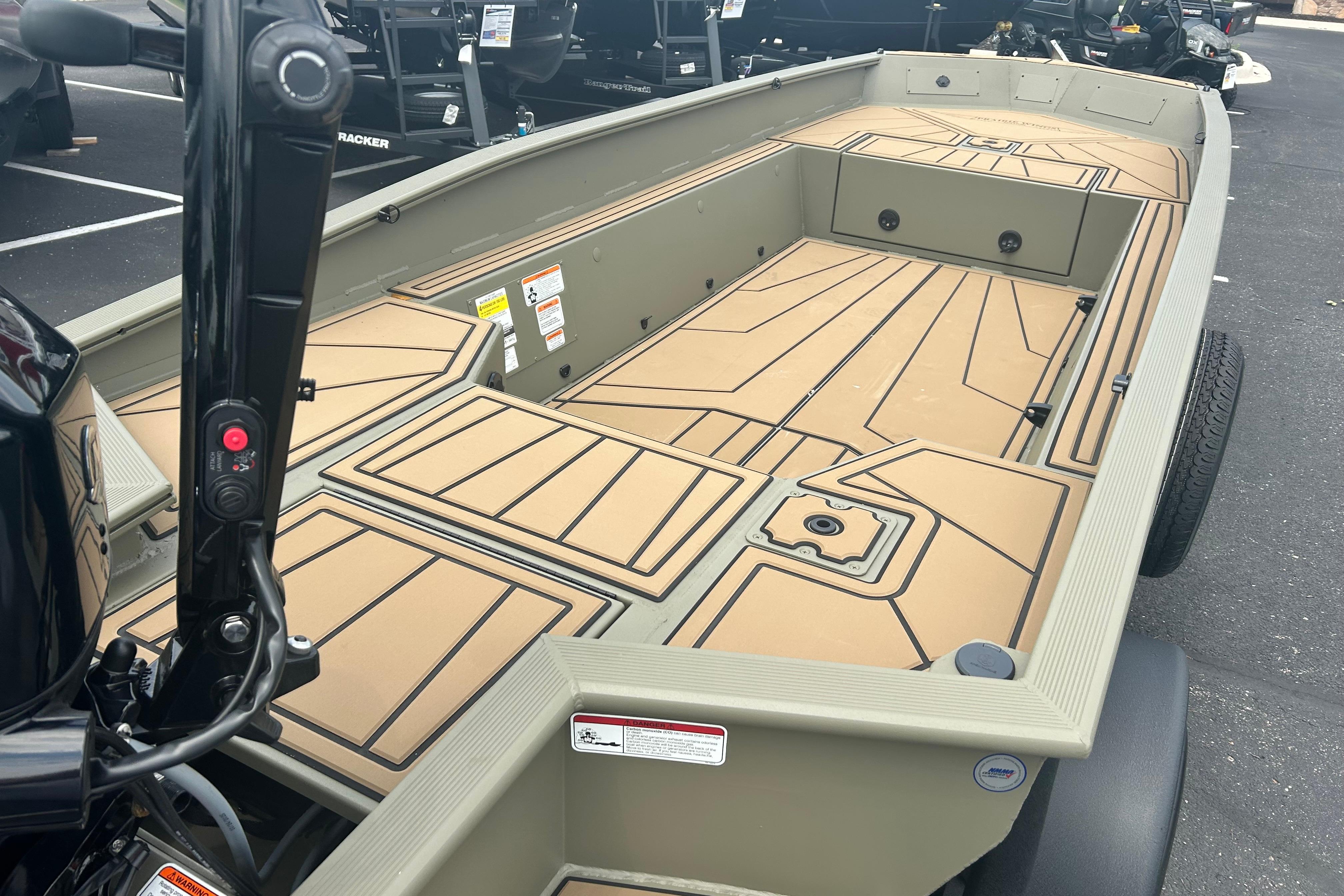 2026 Tracker Grizzly 1650 T Prairie Wings Edition boat interior with tan deck design.