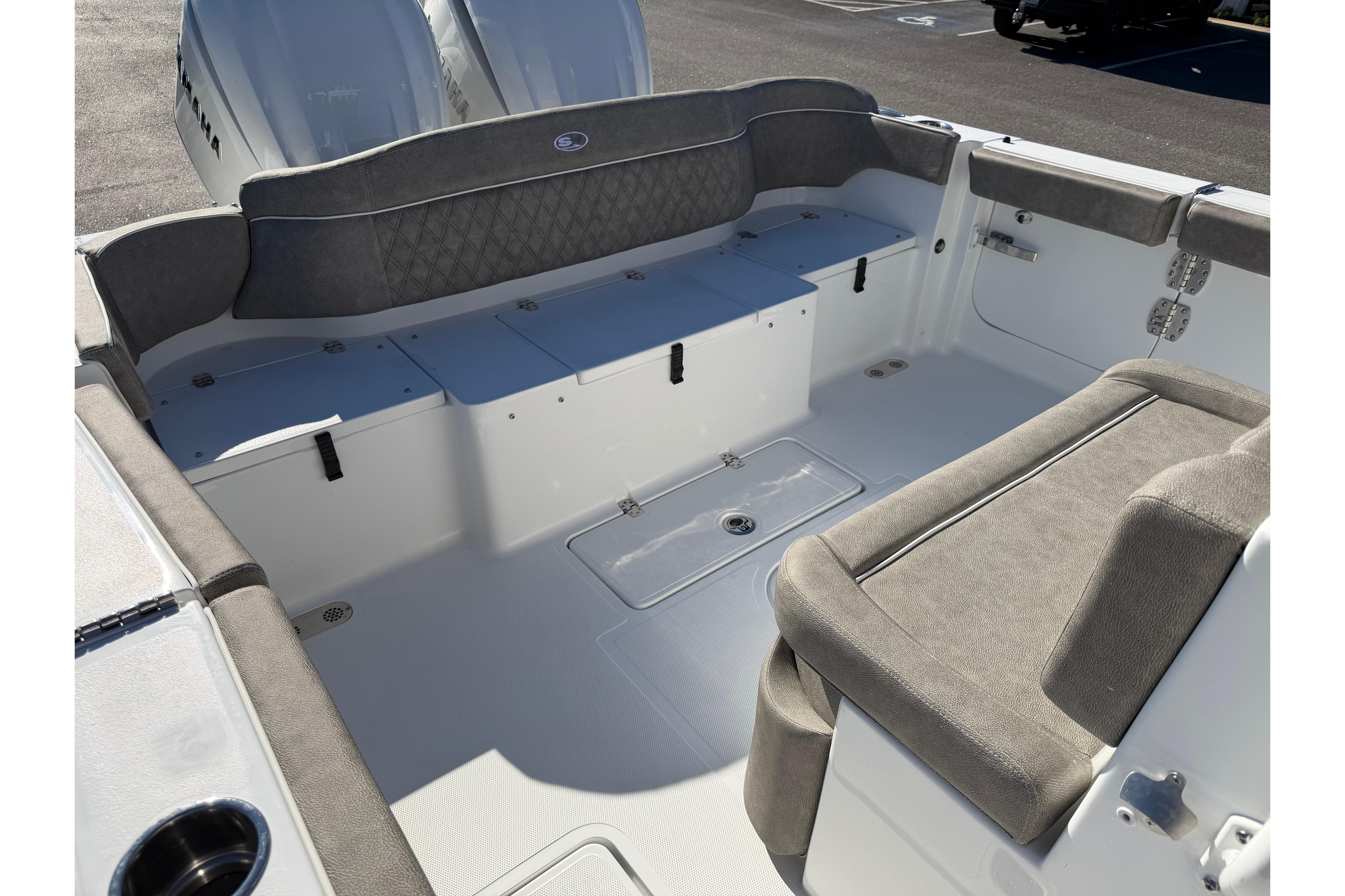 2026 Sea Hunt Ultra 275 Coffin Box boat interior with cushioned seating and storage.