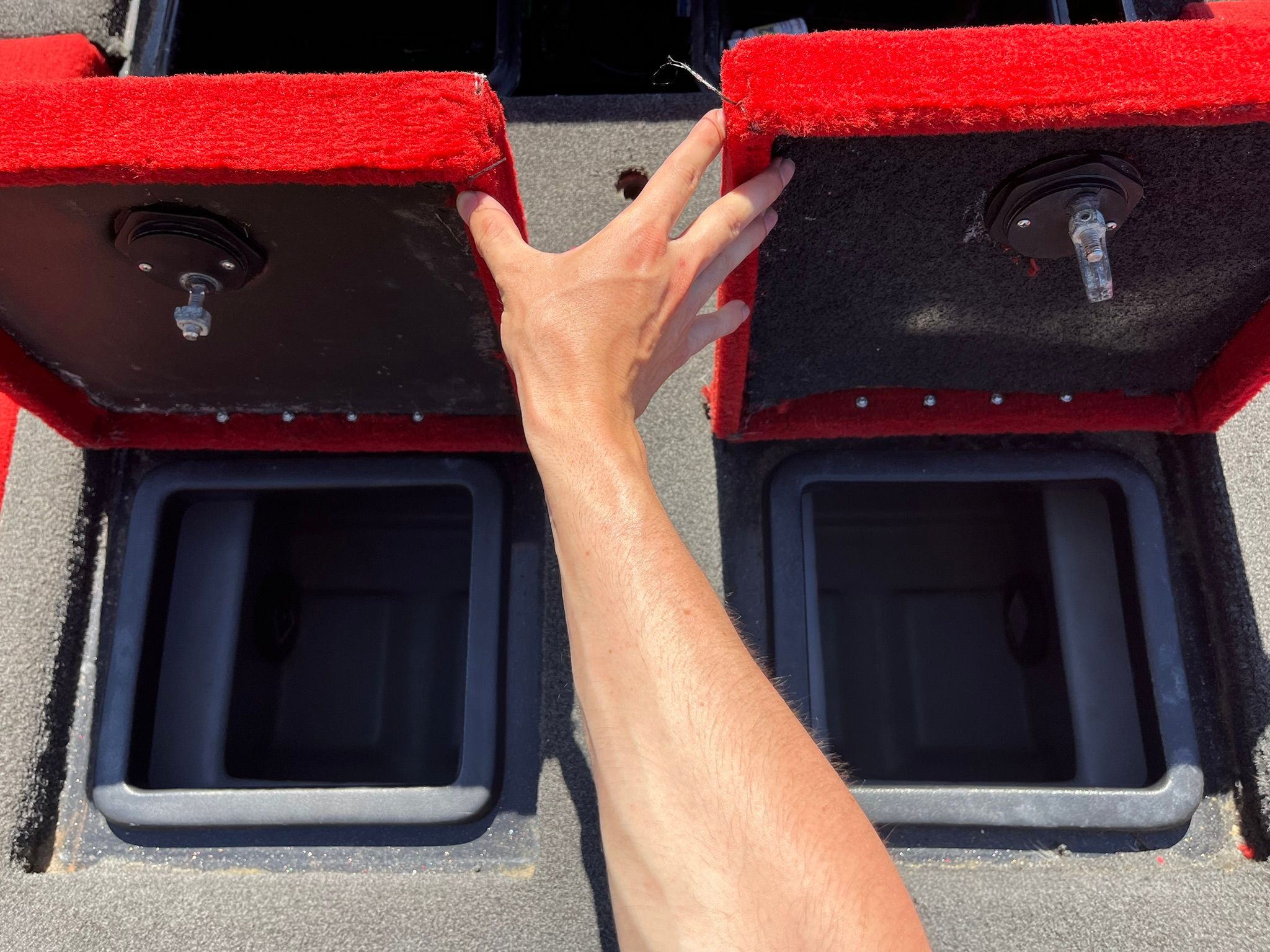 Hand opening storage compartments on 2013 Nitro Z-9 boat.