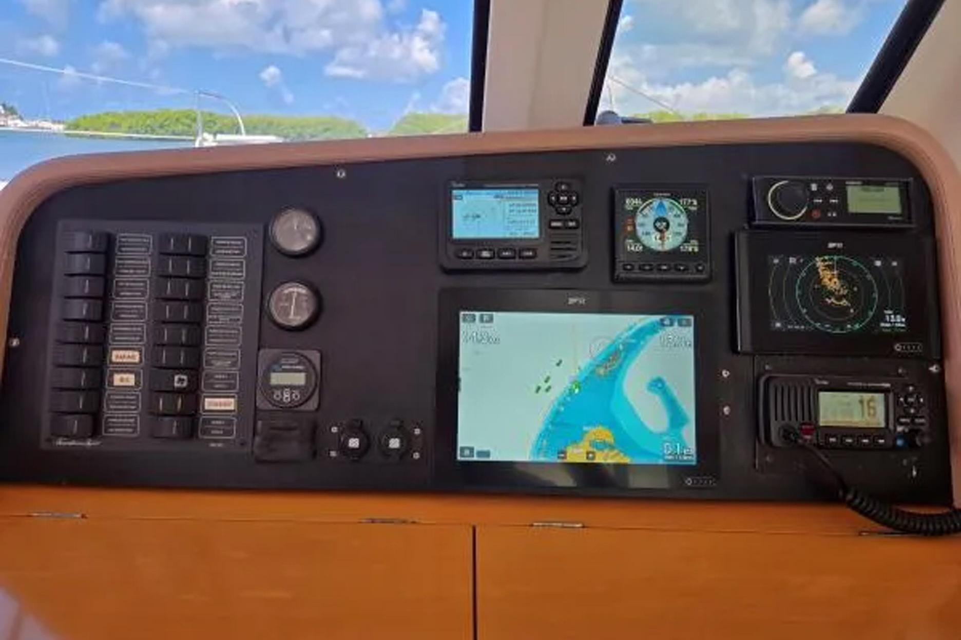 Navigation panel of 2008 Fountaine Pajot Salina 48 catamaran with electronic displays and controls.