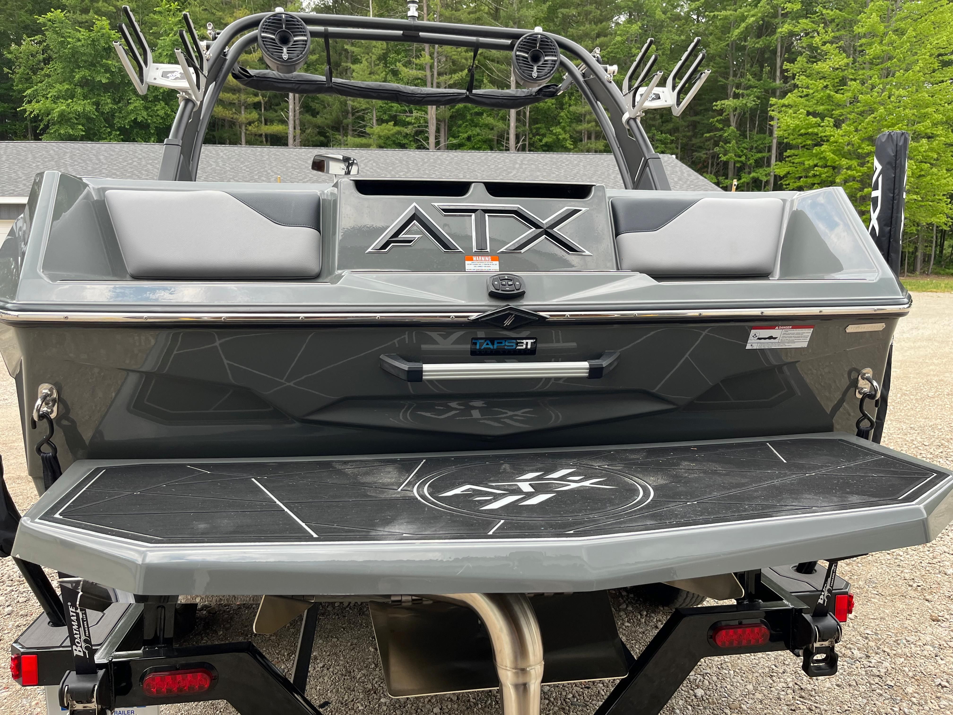 The image shows the rear of a 2022 ATX Surf Boats 22 Type-S with a gray finish.