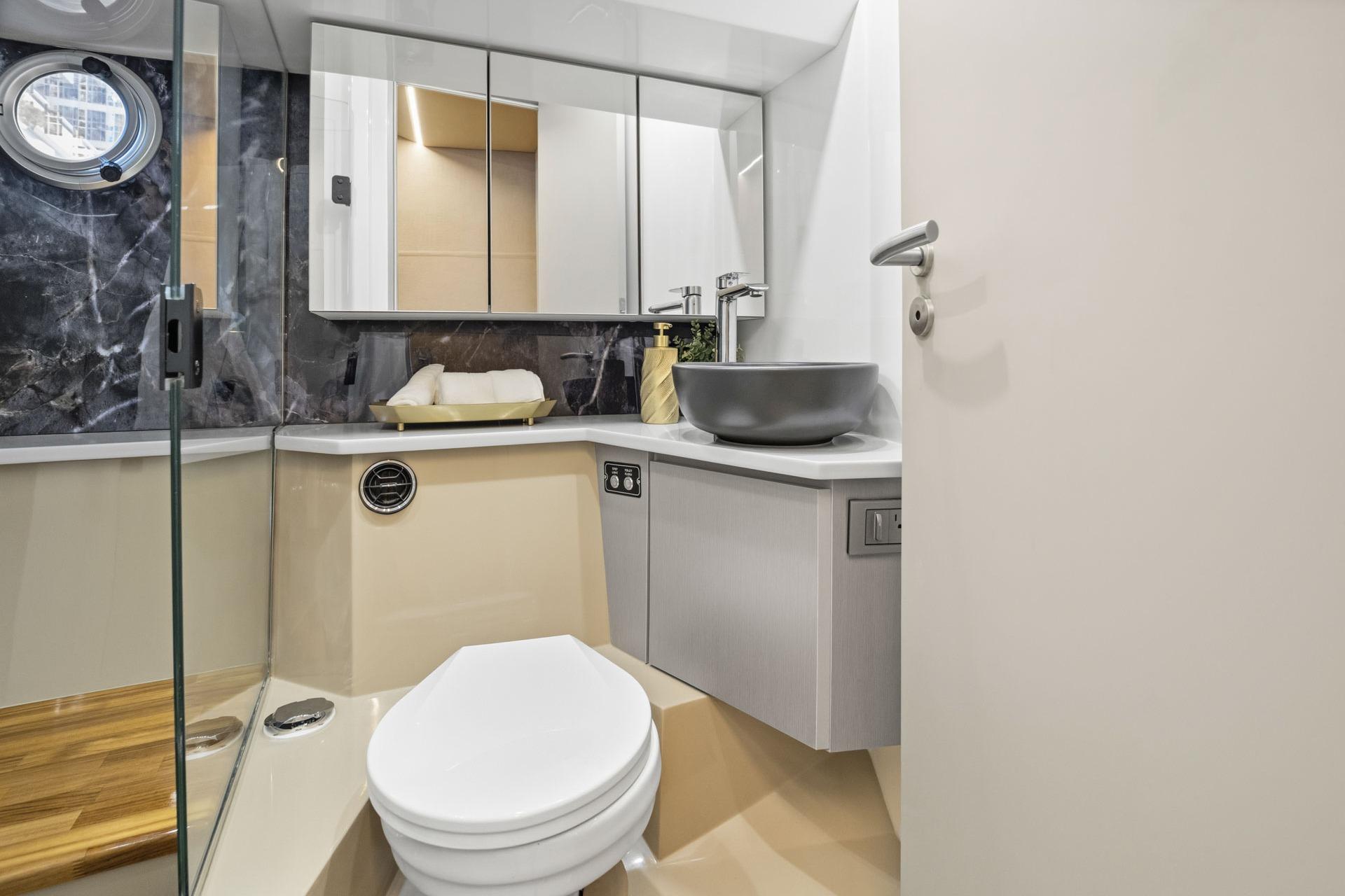 Modern bathroom interior on Hanover 447 yacht, 2026 model, featuring sleek design and elegant fixtures.