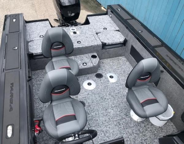 2025 Tracker Targa V18 Combo boat interior with gray seating and carpeted flooring.