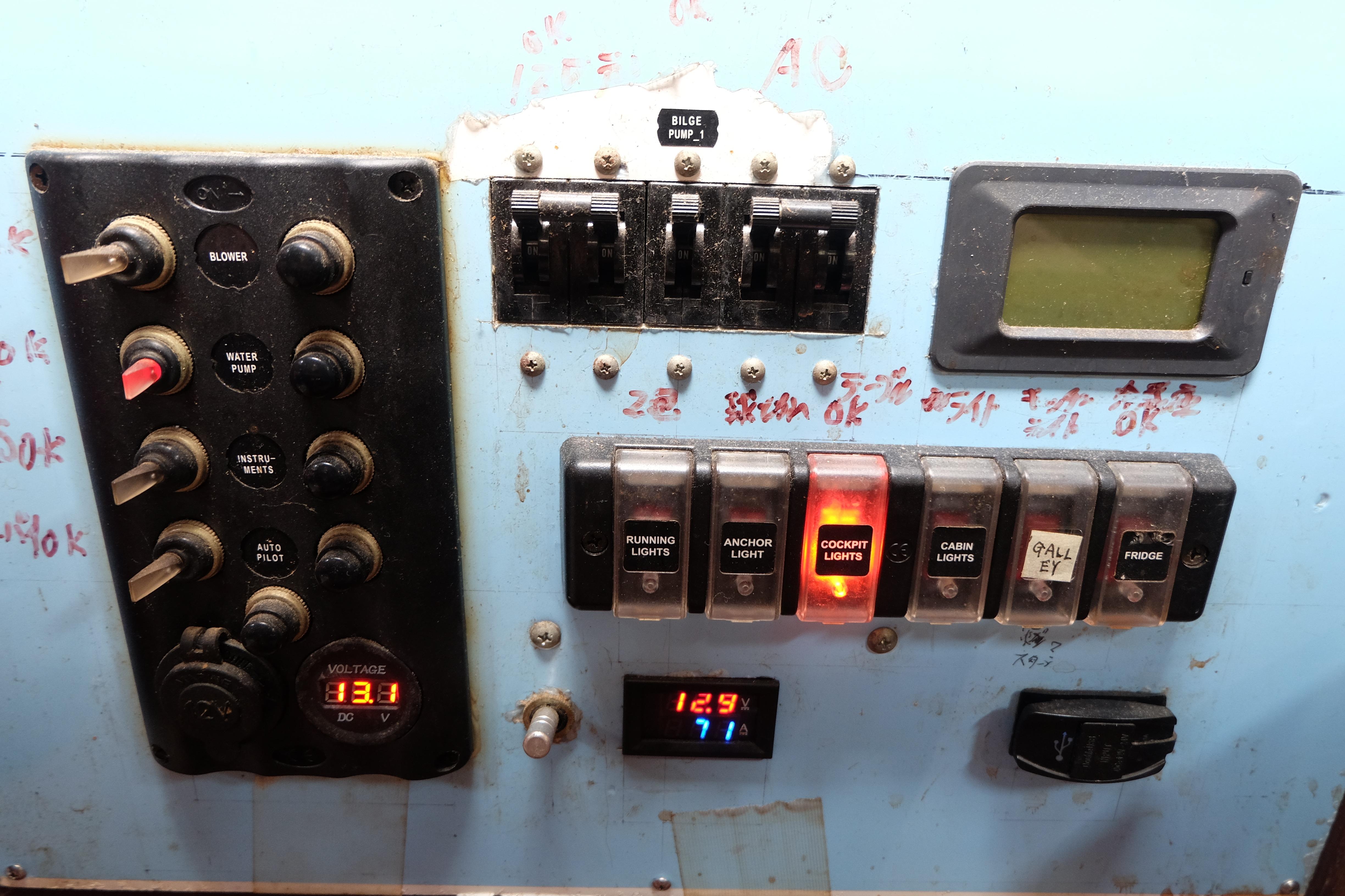 Control panel of a 1979 Westwind 35 boat with switches and voltage display.
