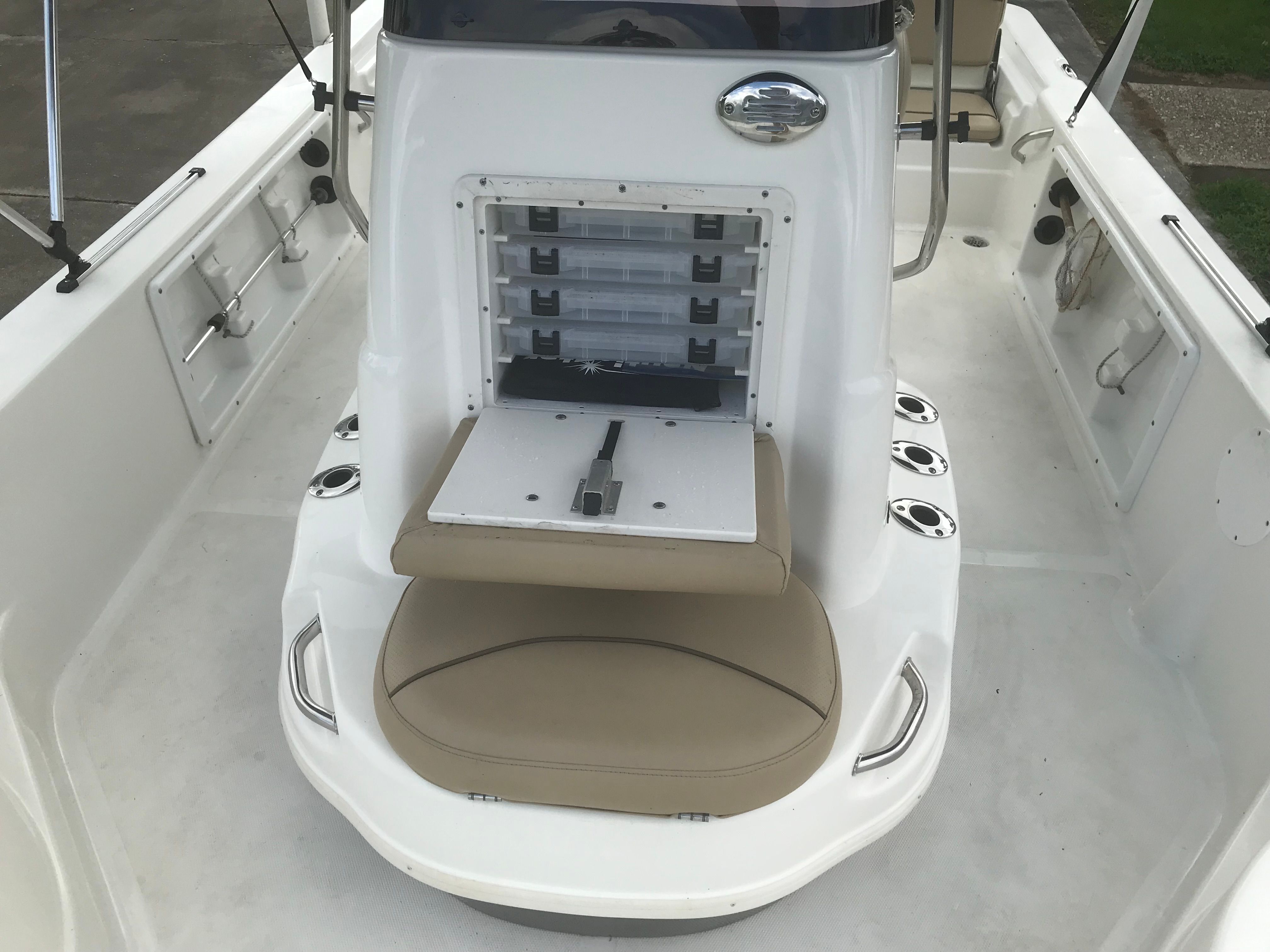 Interior view of a 2020 NauticStar 215 XTS boat with storage area.