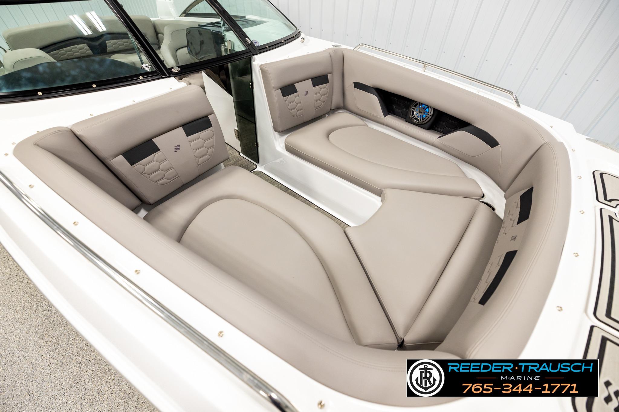 2024 FOURWINNS HD5 Surf boat interior with beige seating and modern design.