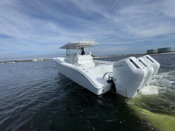 2025 Yellowfin 39 Offshore boat with triple Mercury engines on open water.
