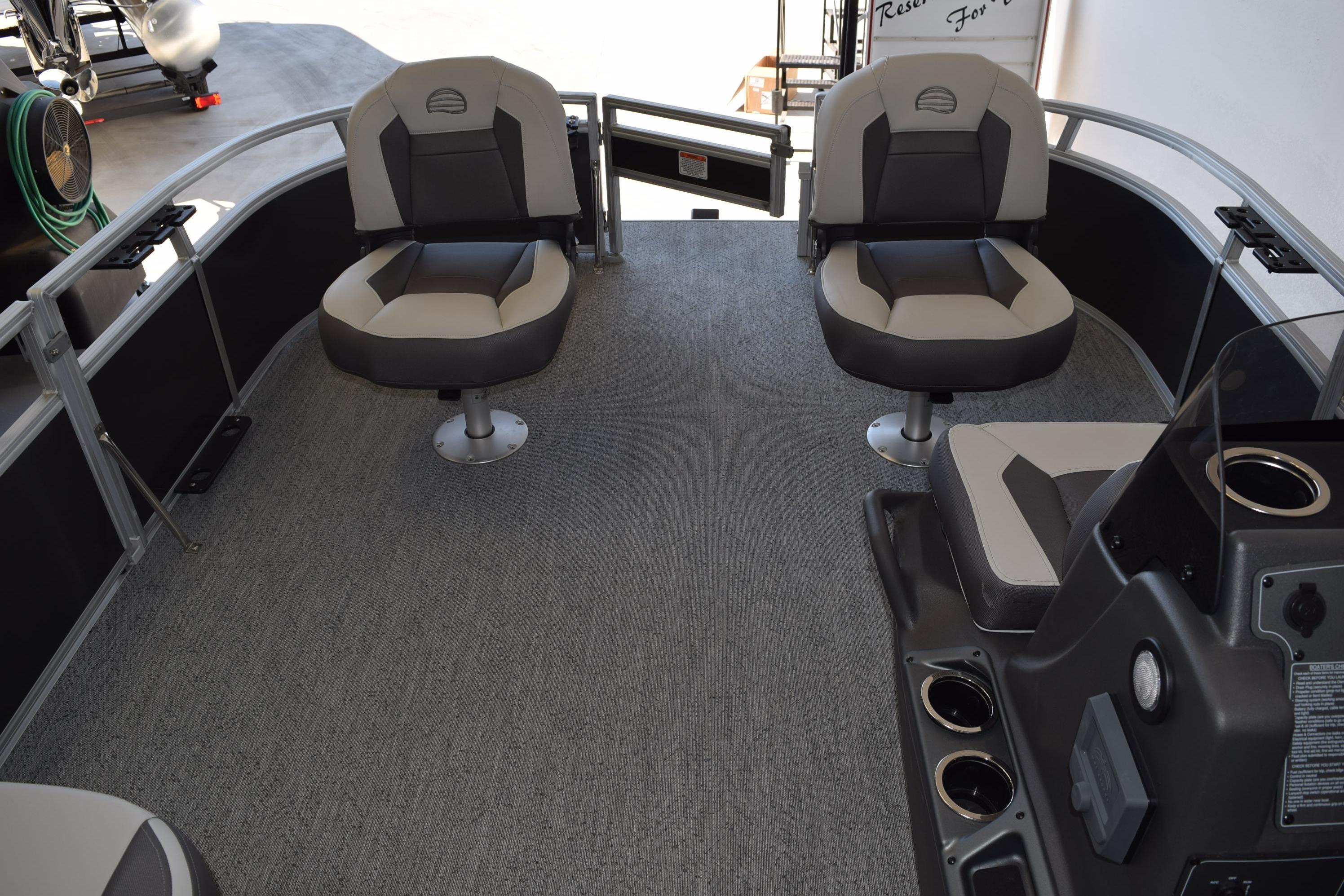 2026 Sun Tracker Bass Buggy 16 XL Select interior with swivel seats and console.