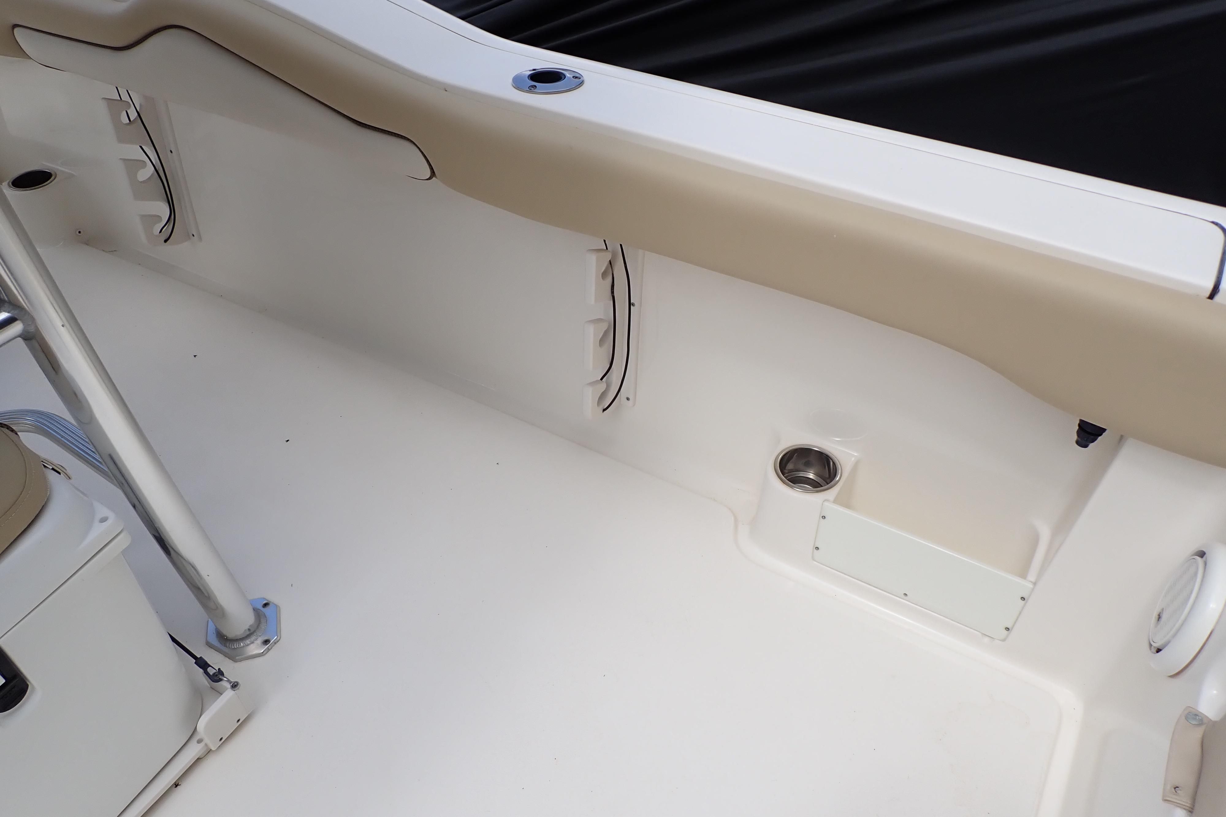 2019 Key West 263 FS boat interior with beige seating and stainless steel fixtures.