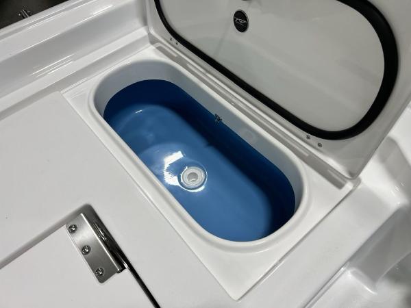 2025 Tidewater 2300 Carolina Bay boat livewell with open lid.