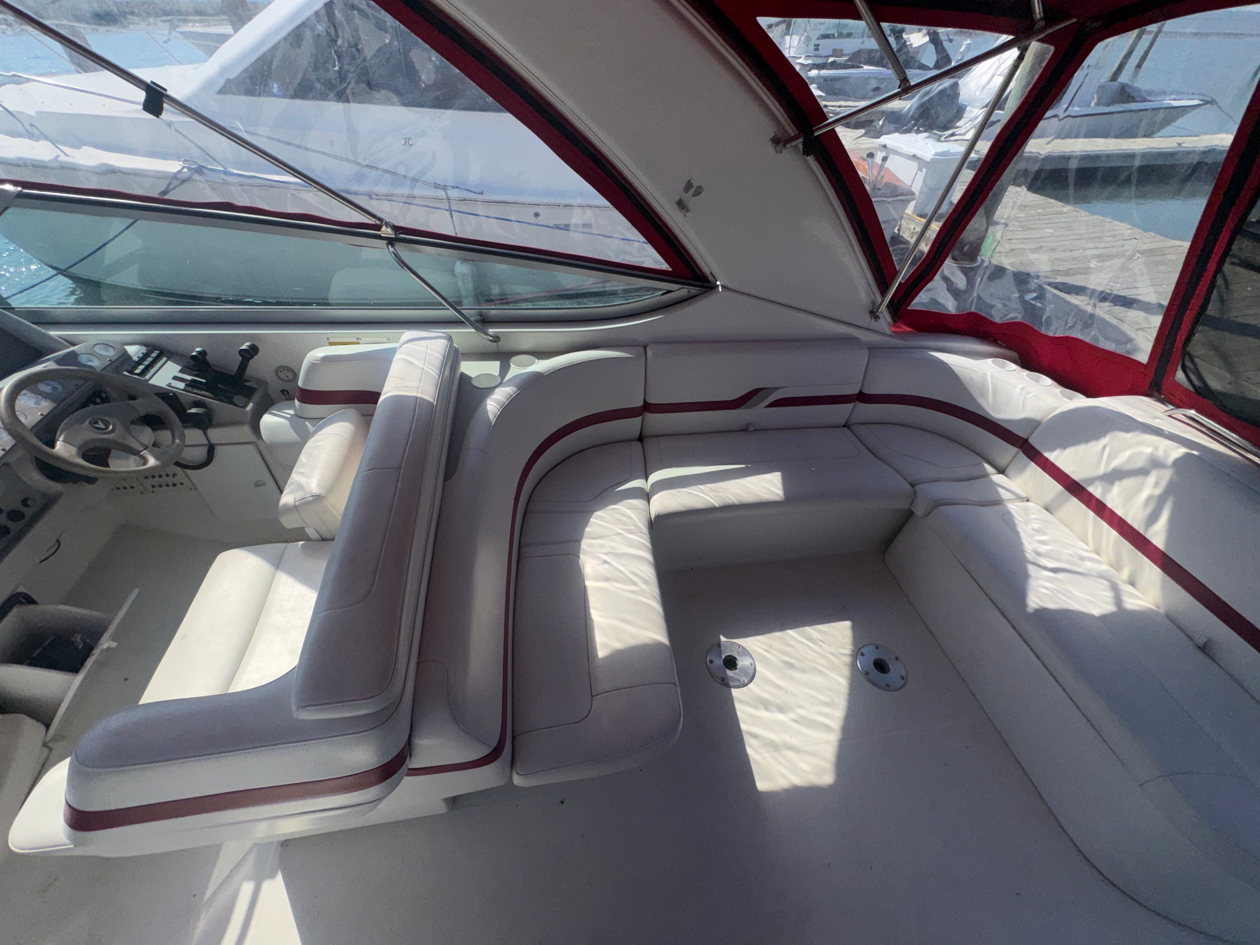 Interior of a 2001 Formula 37 SUPER SPORT yacht with white leather seating.