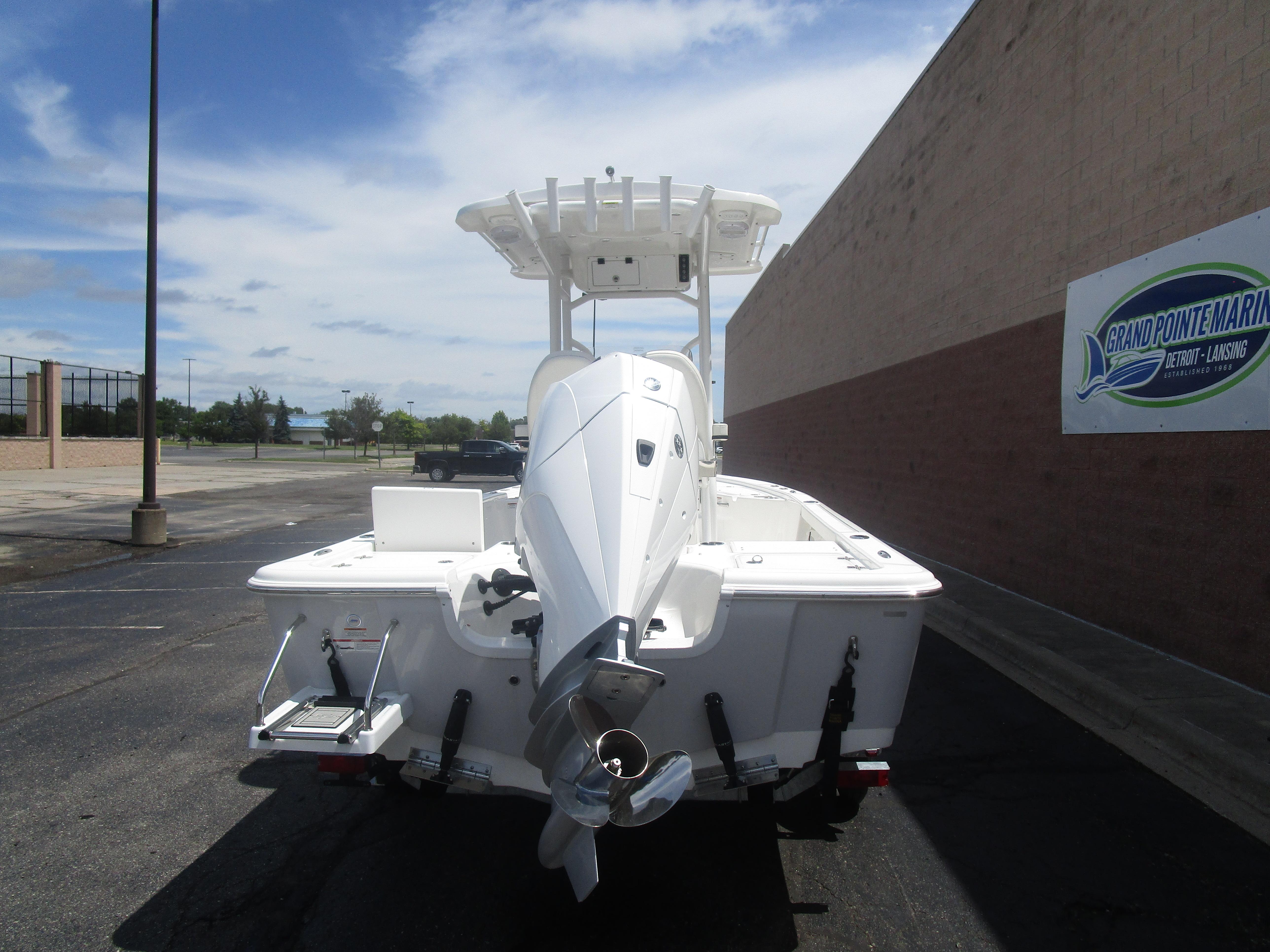 2025 Sea Pro 230 DLX BAY boat, rear view, parked at Grand Pointe Marina.