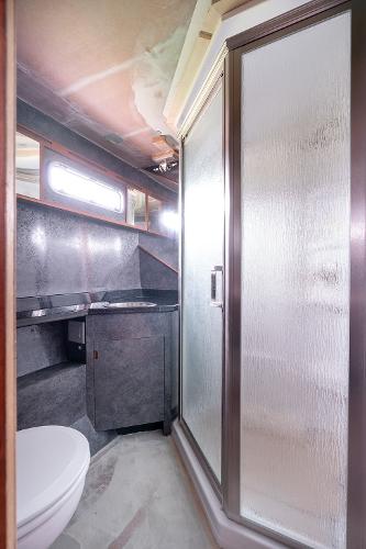 Modern bathroom in 2025 Catamaran Bloomfield 86 Motorsailor with shower and sleek design.