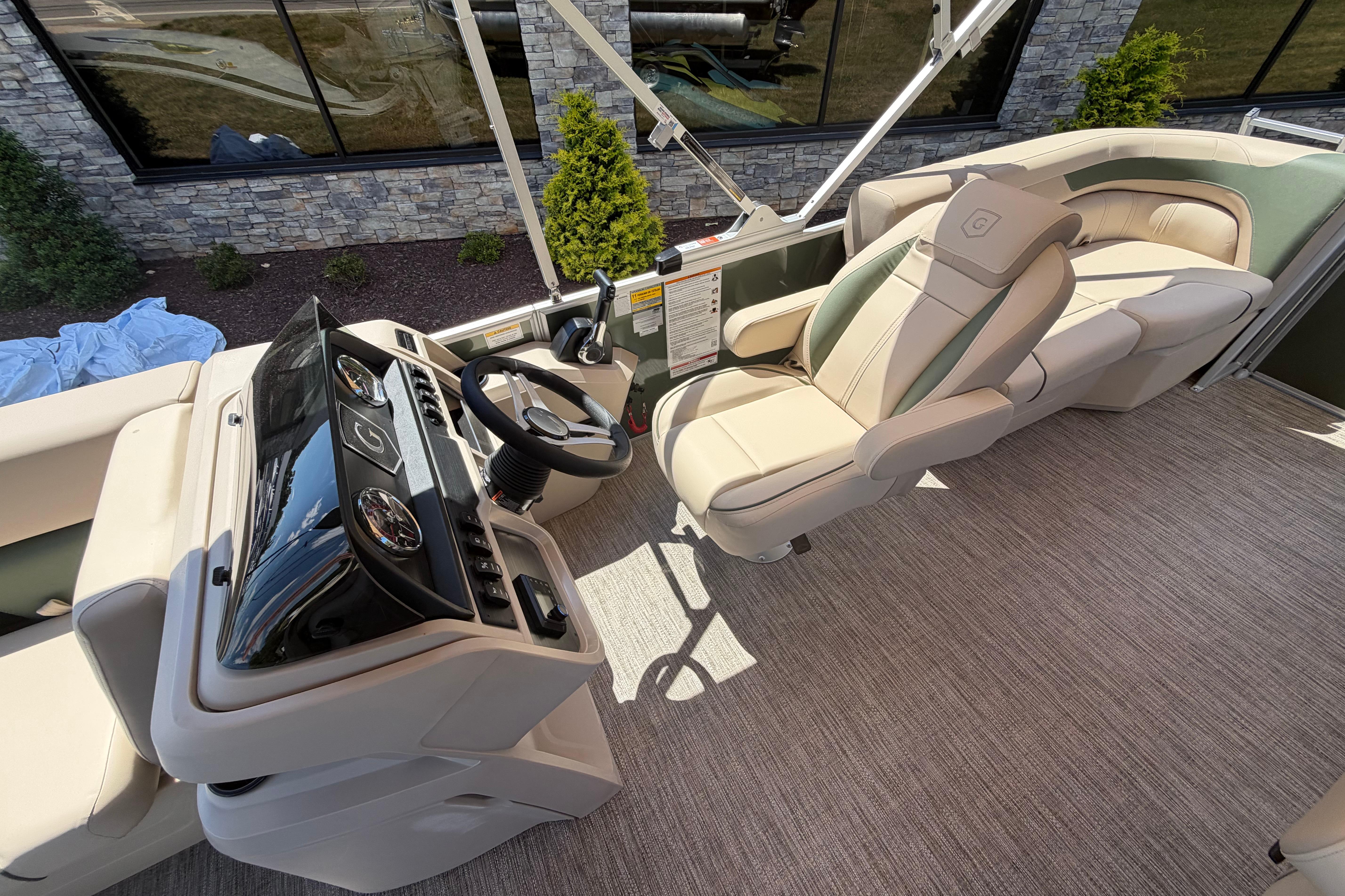 Luxurious interior of 2026 Godfrey SW 2086 SBC boat with plush seating and modern dashboard.