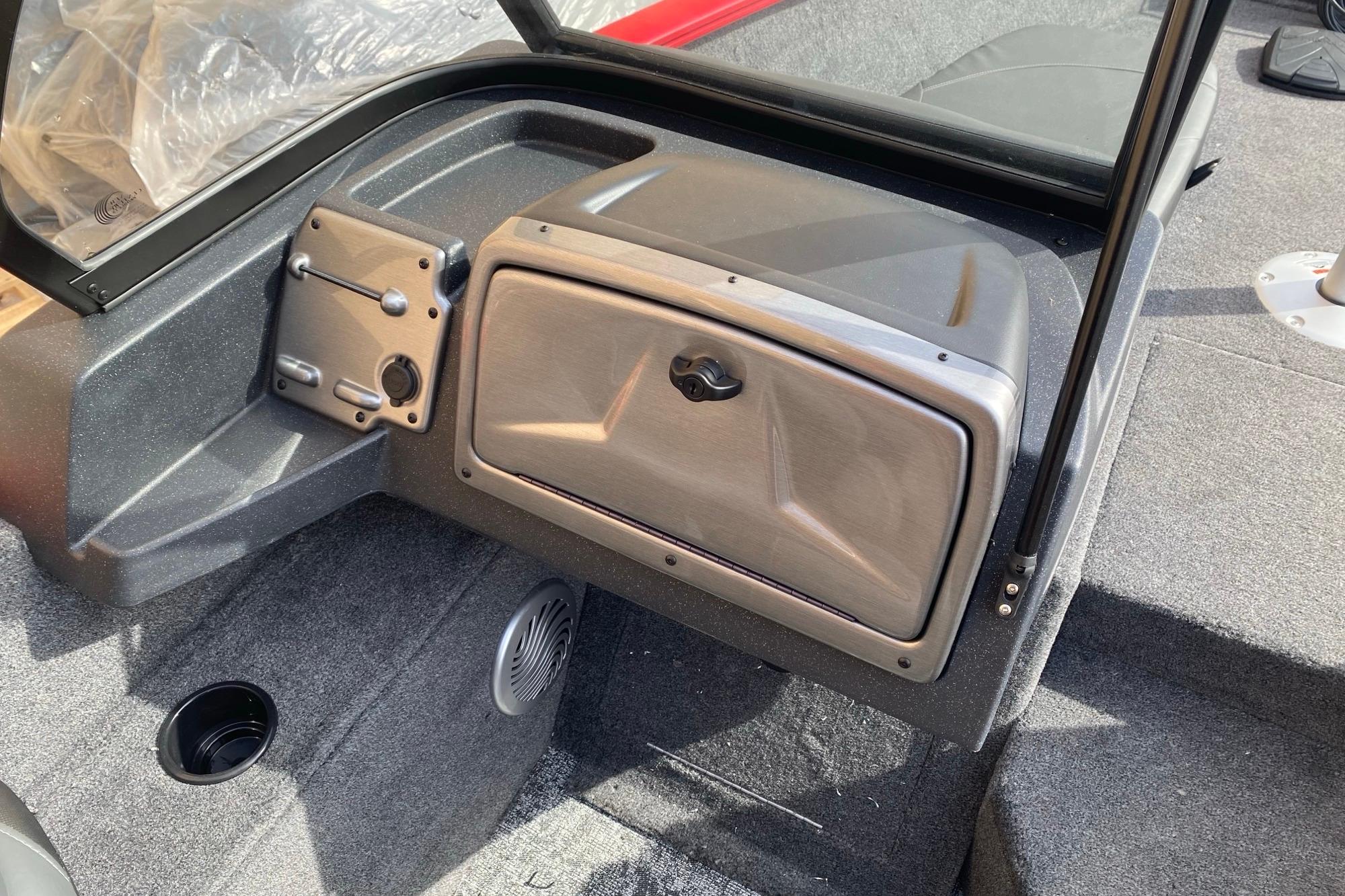 2026 Tracker Pro Guide V-175 Combo boat interior with storage compartment and speaker.
