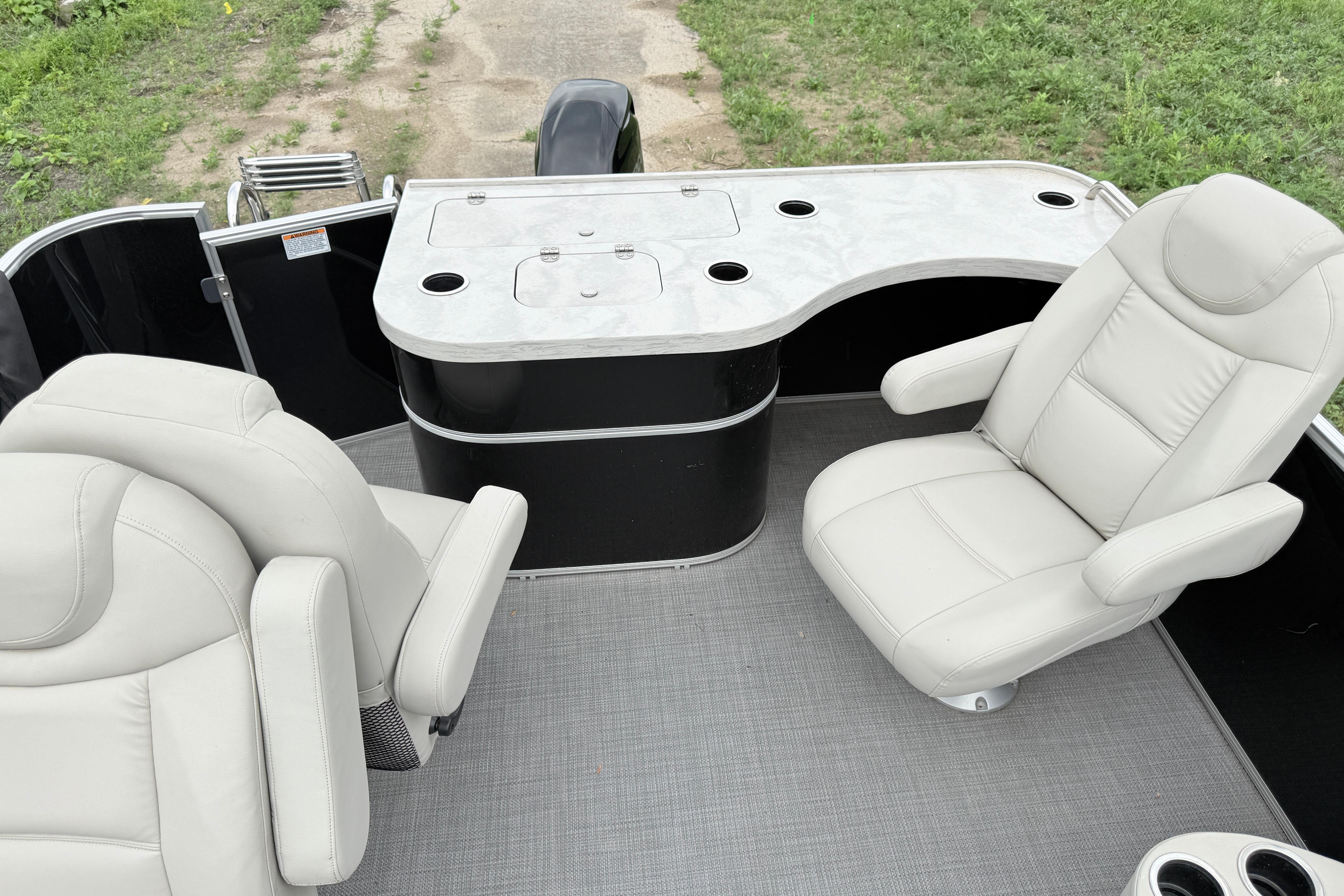 2019 Sylvan 8522 Mirage Signature F-n-C pontoon boat interior with plush seating and sleek design.