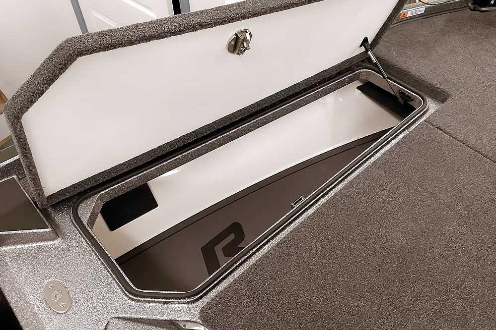 2026 Ranger Z519R Cup-Equipped boat storage compartment with open lid, showcasing interior space.